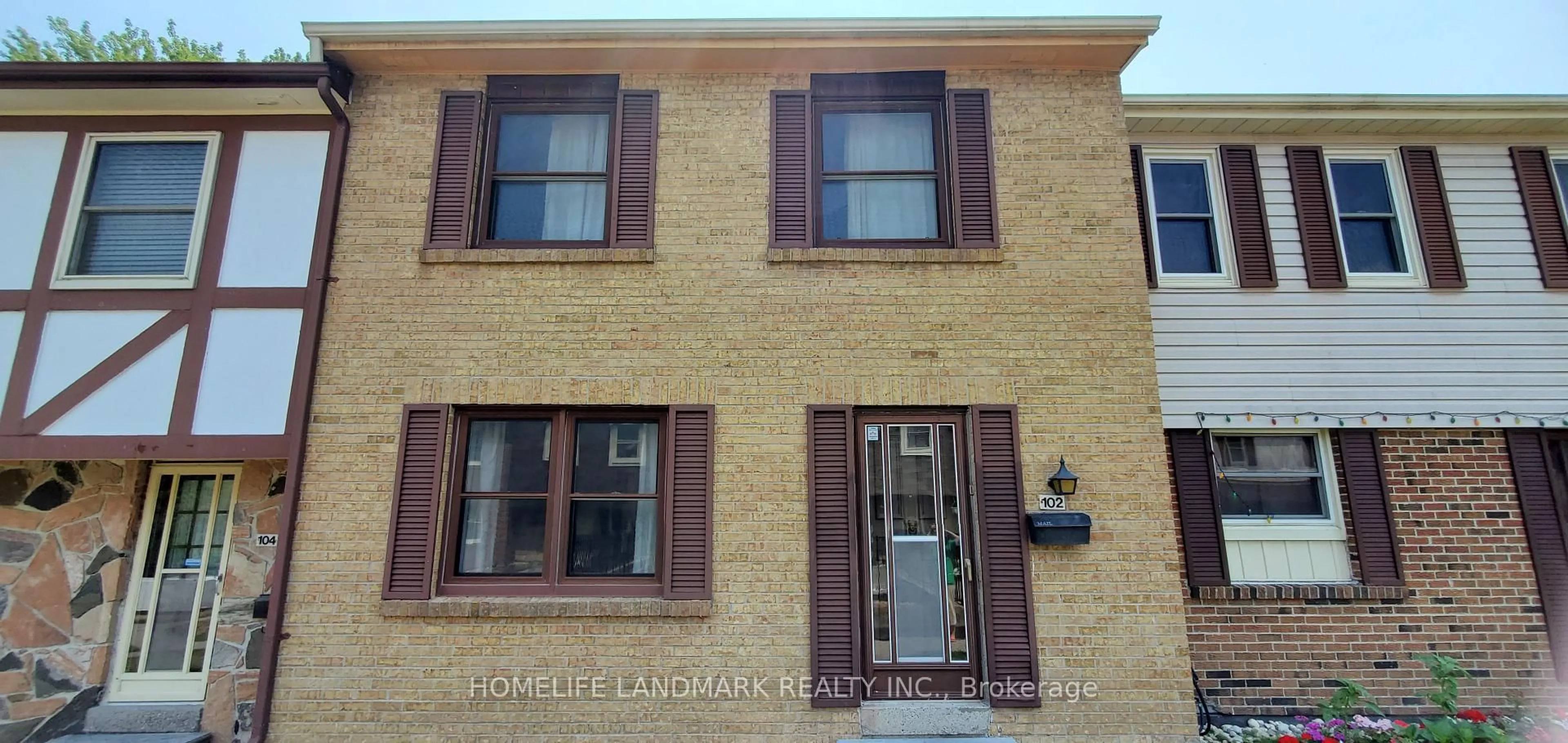 Home with brick exterior material, street for 91 L'Amoreaux Dr #102, Toronto Ontario M1W 2J8