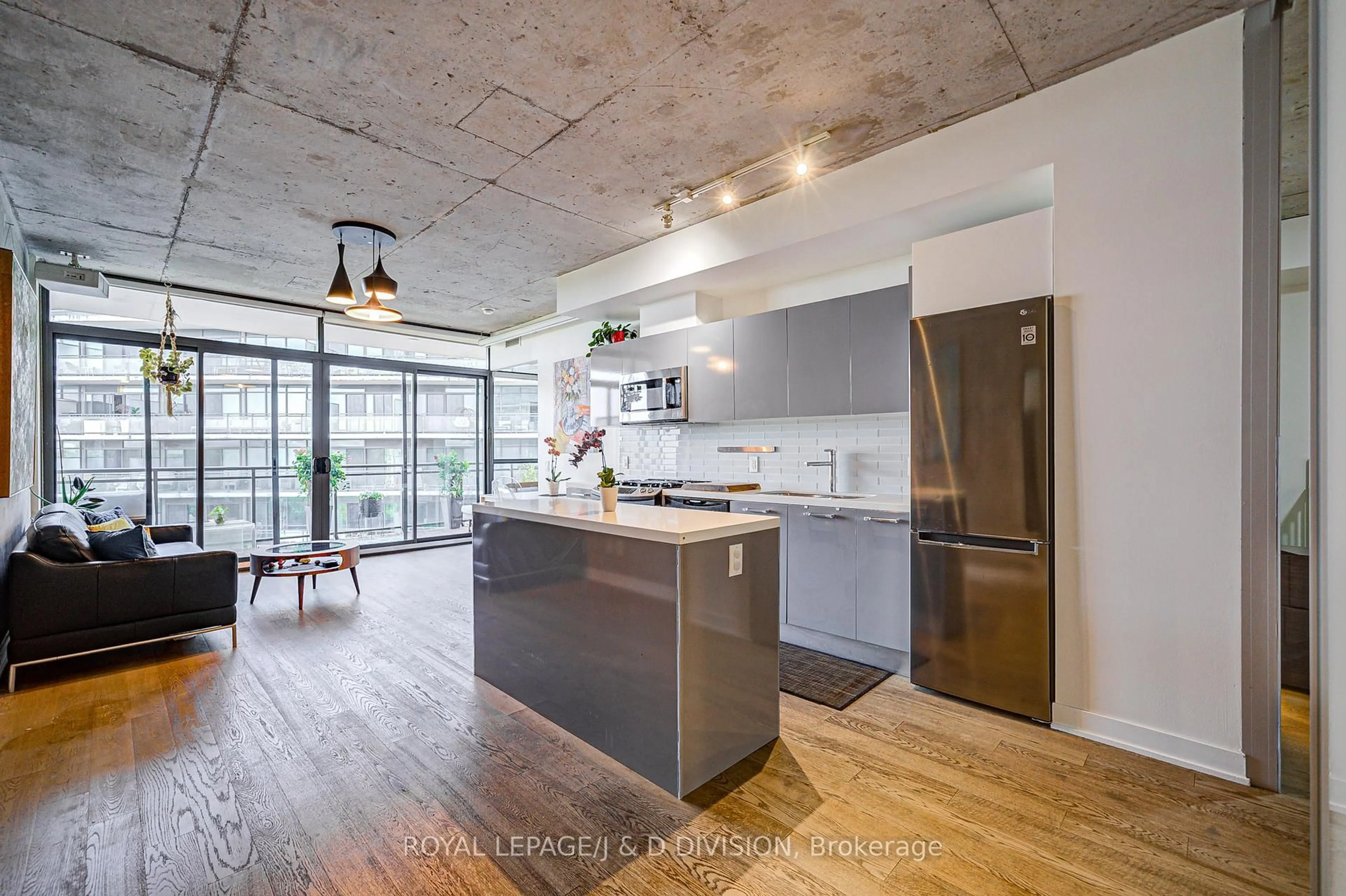 Open concept kitchen, cement floor for 1201 Dundas St #810, Toronto Ontario M4M 1S2