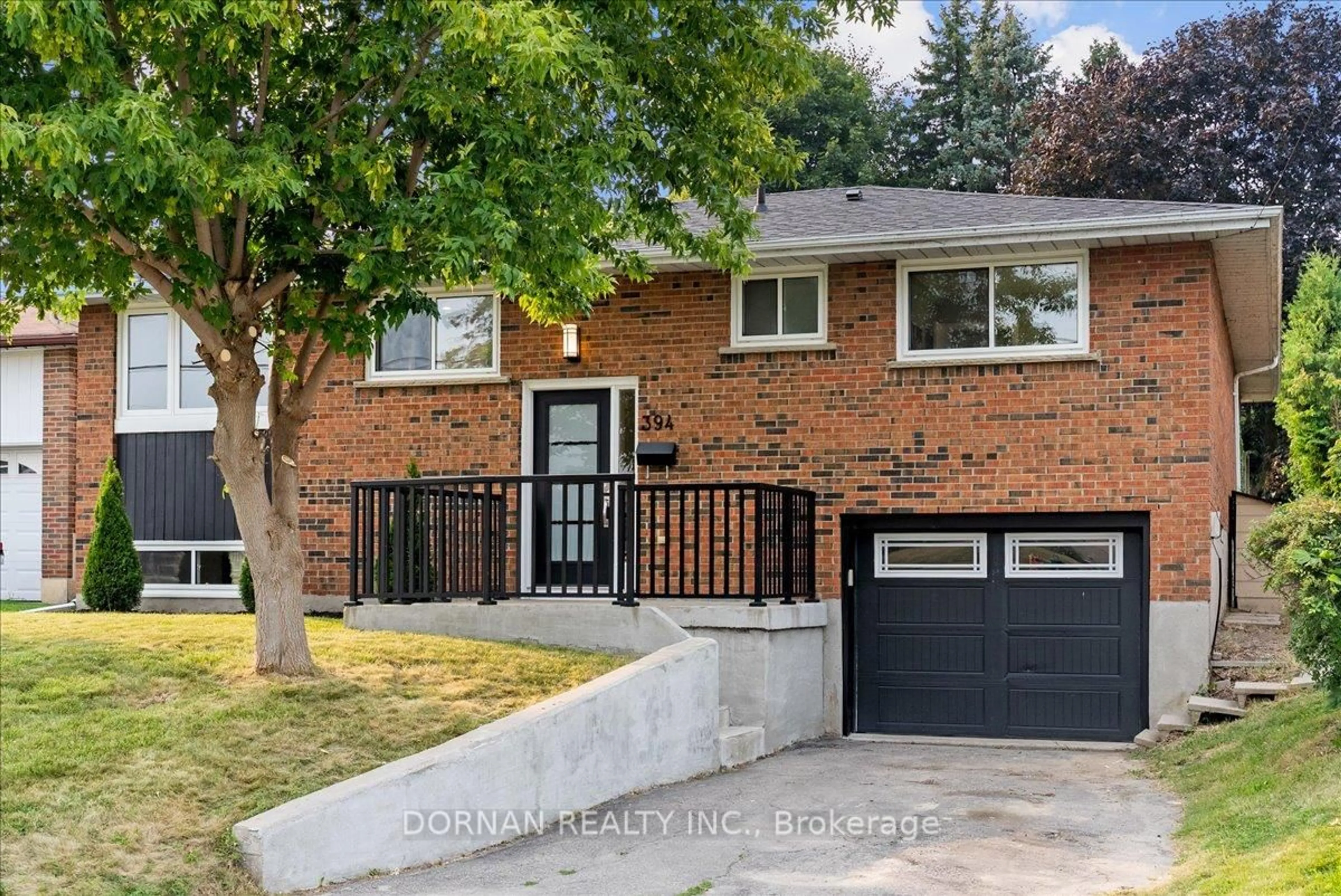 Home with brick exterior material, street for 394 Rossland Rd, Oshawa Ontario L1G 2X1