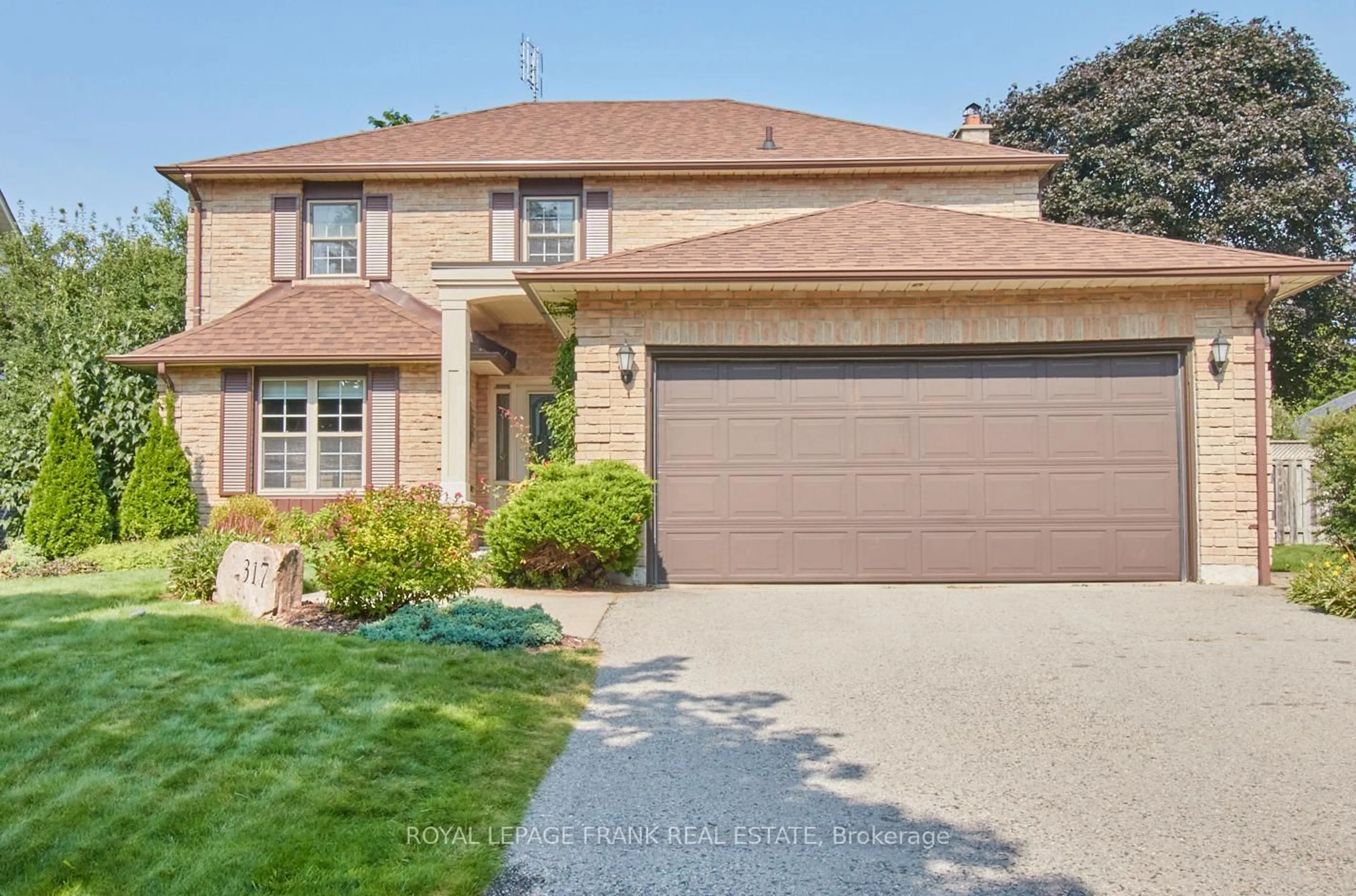 Home with brick exterior material, street for 317 Prince Of Wales Dr, Whitby Ontario L1N 6P2