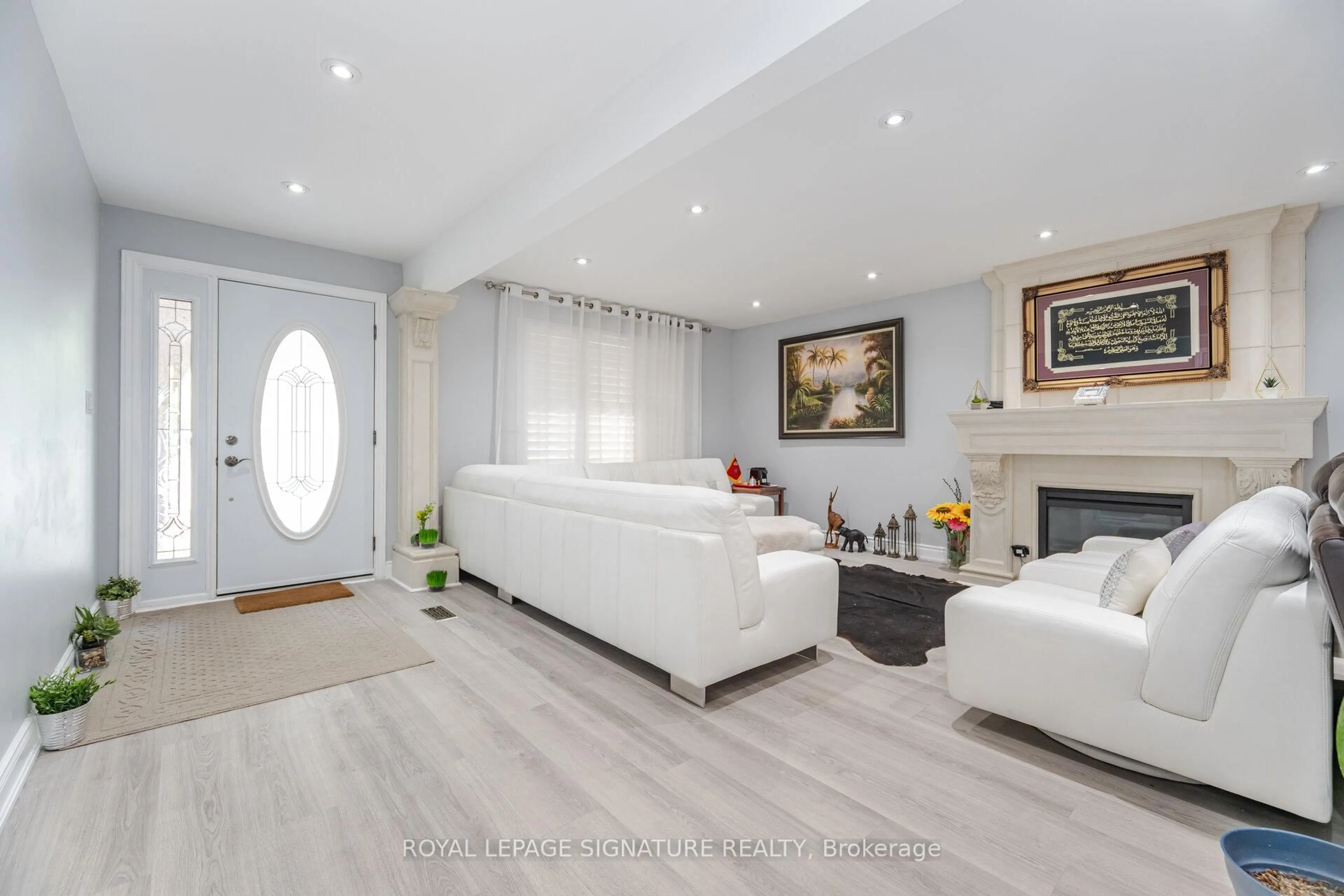 Living room with furniture, wood/laminate floor for 574 Antigua Cres, Oshawa Ontario L1J 6B4