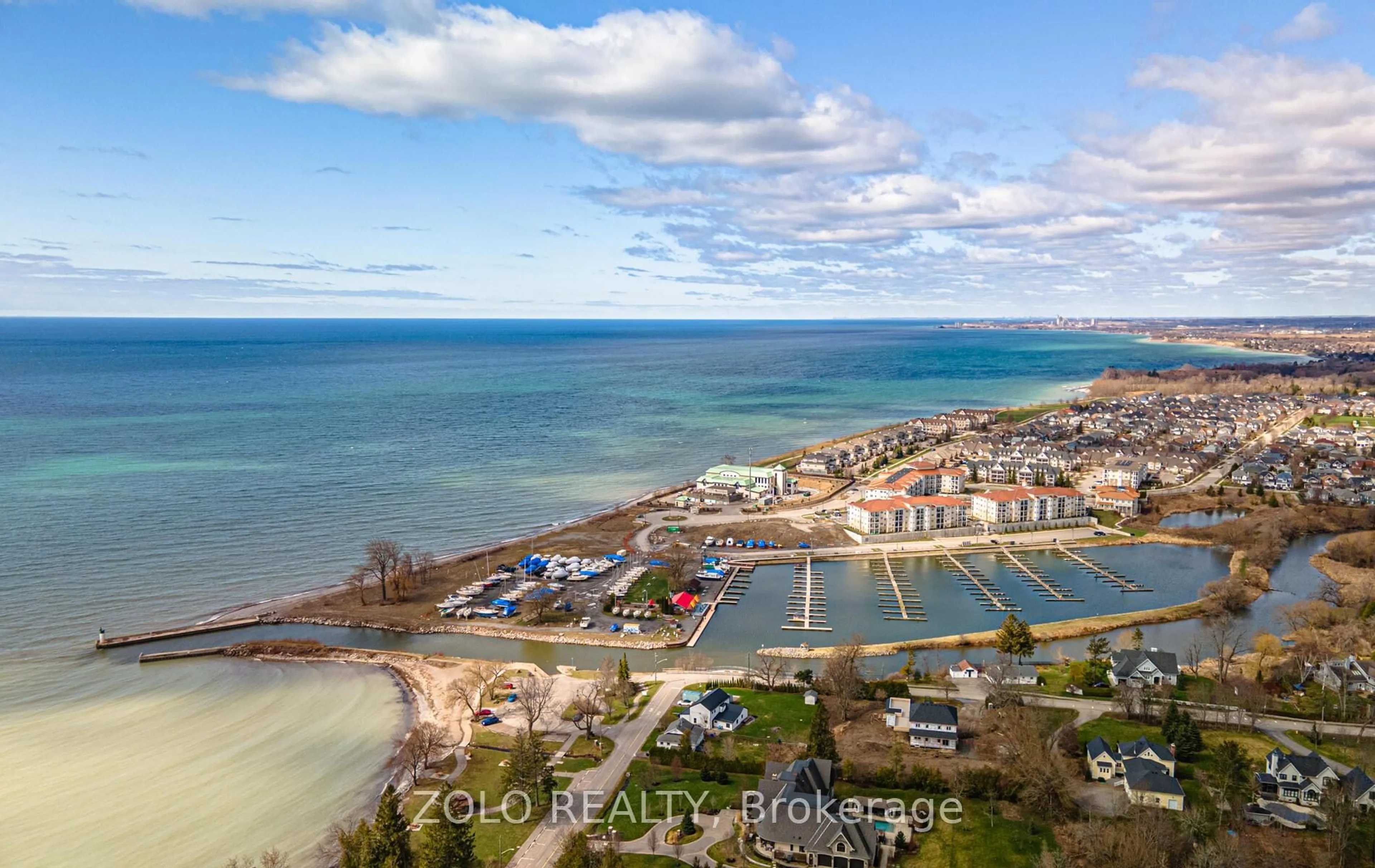A pic from outside/outdoor area/front of a property/back of a property/a pic from drone, water/lake/river/ocean view for 50 Lakebreeze Dr #215, Clarington Ontario L1B 0V9