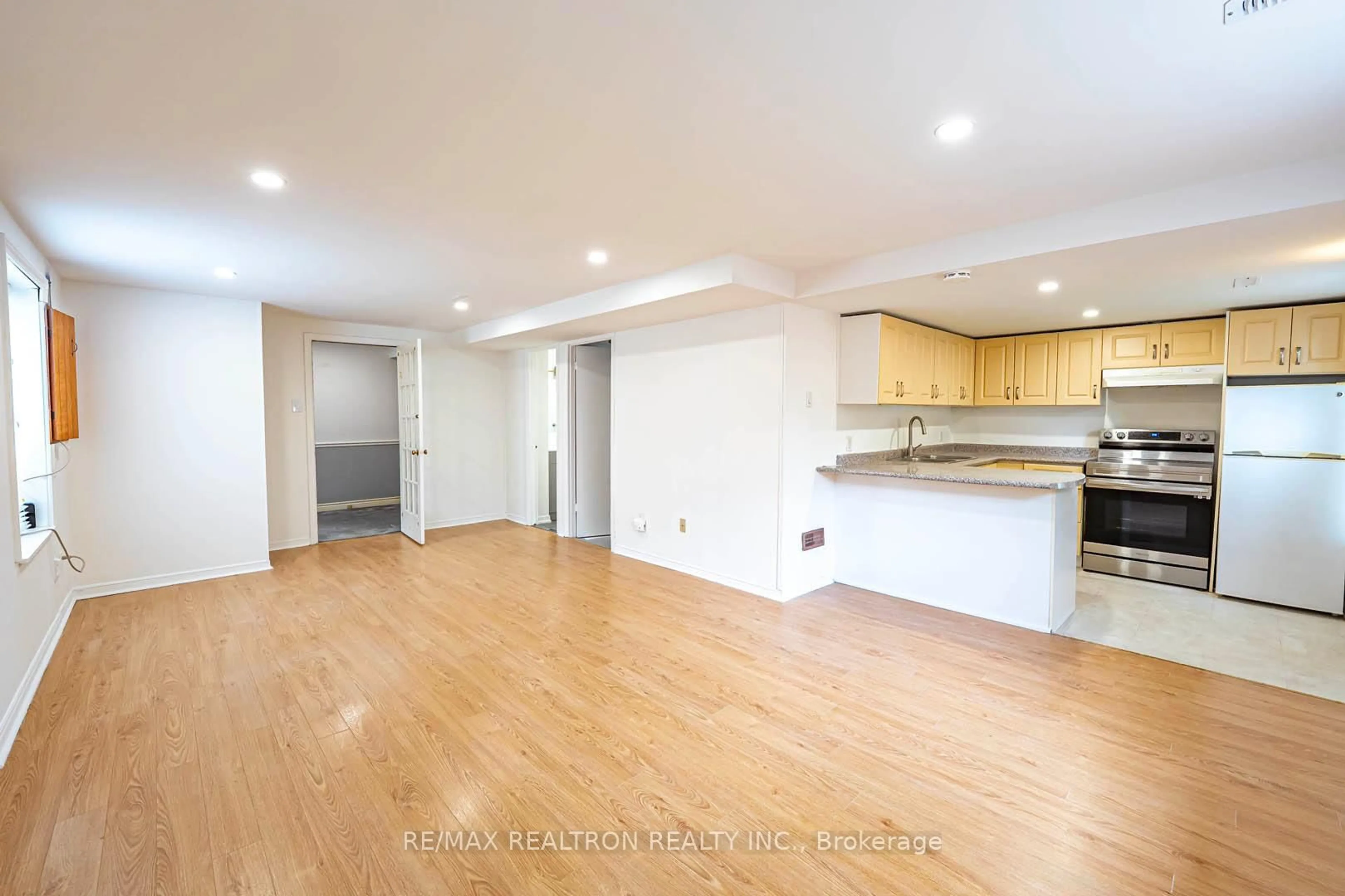 Open concept kitchen, wood/laminate floor for 28 Invergordon Ave, Toronto Ontario M1S 2Y8