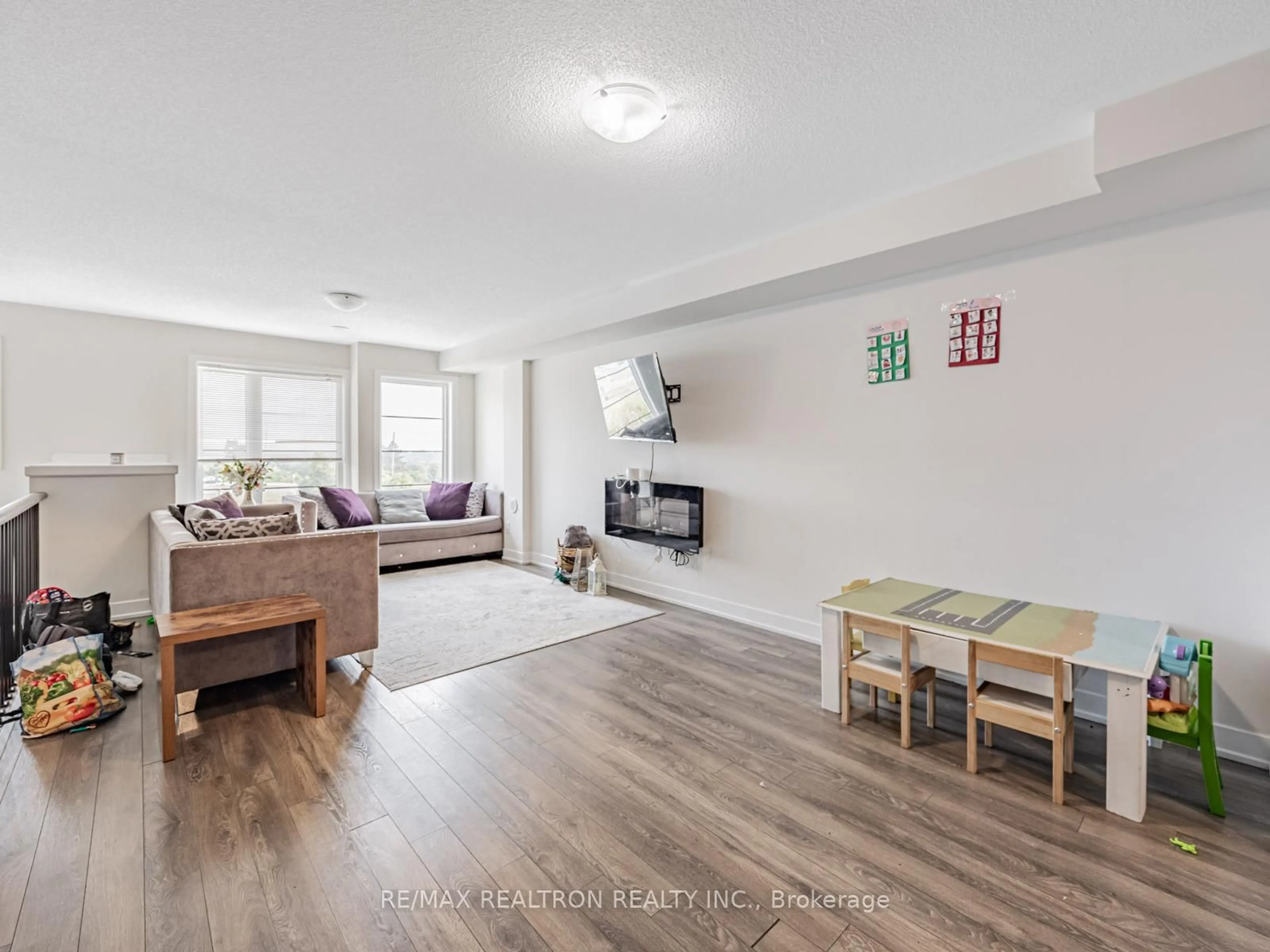 Living room with furniture, wood/laminate floor for 48 Shawfield Way, Whitby Ontario L1R 0N8