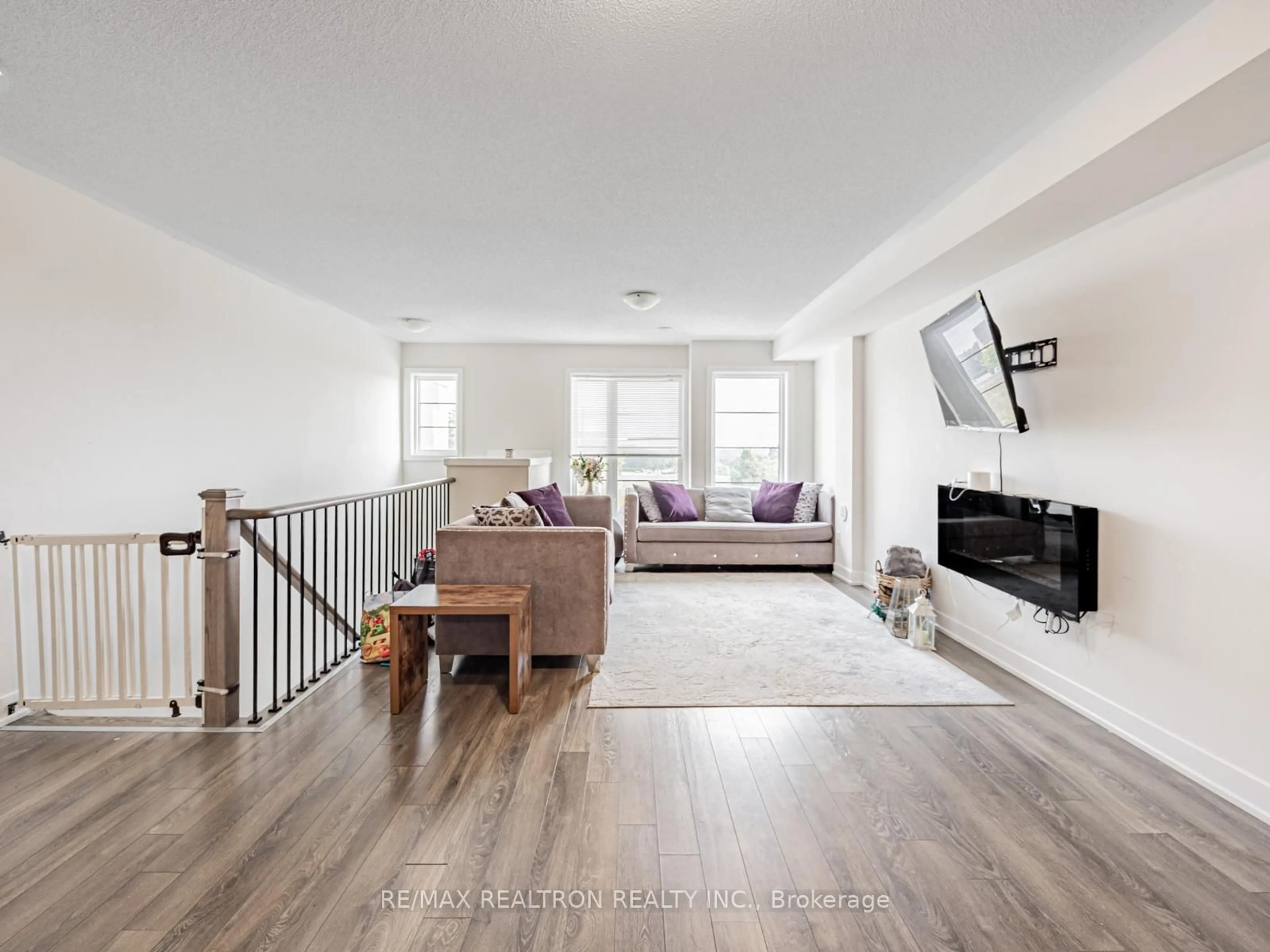 Living room with furniture, wood/laminate floor for 48 Shawfield Way, Whitby Ontario L1R 0N8