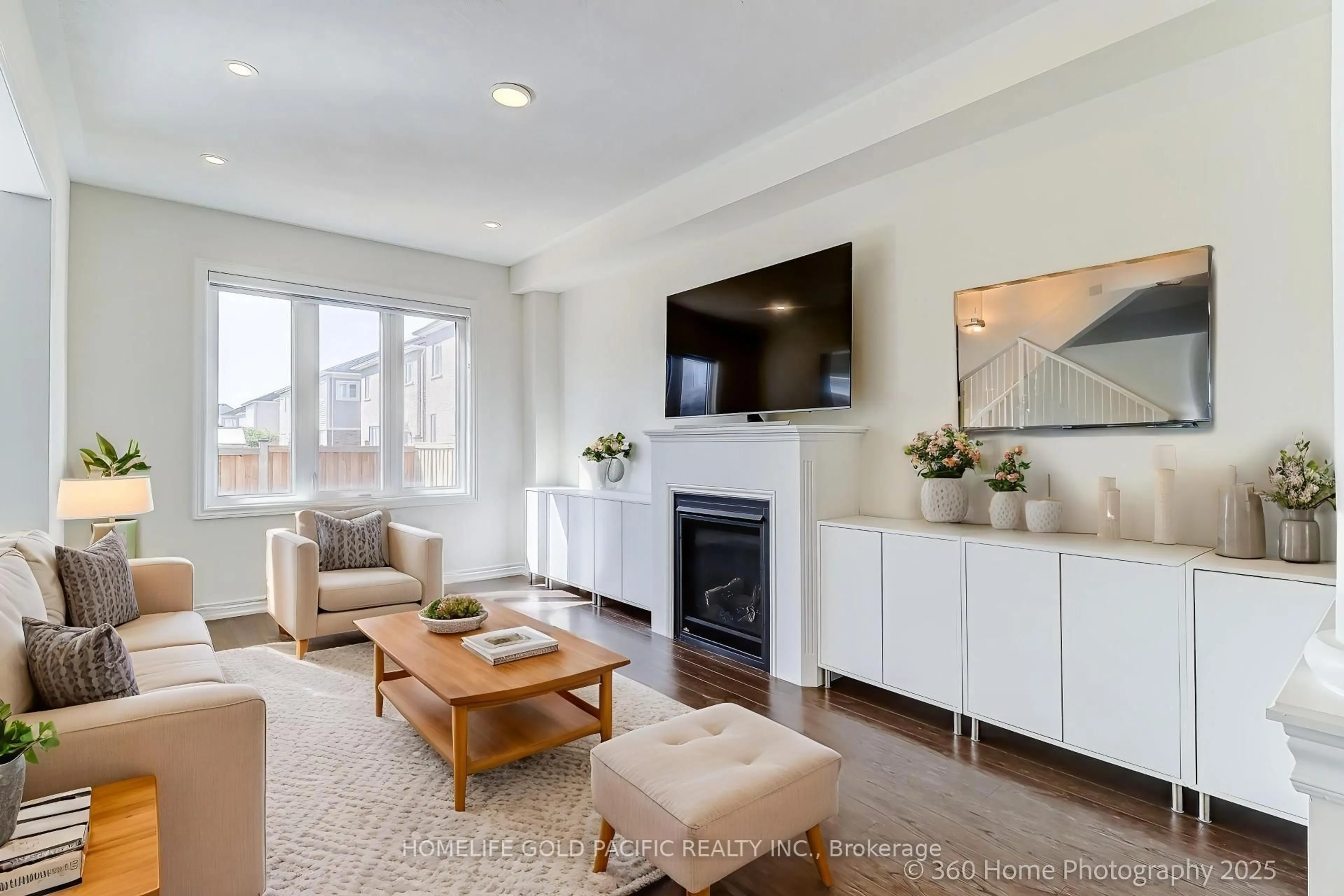 Living room with furniture, wood/laminate floor for 211 Ronald Hooper Ave, Clarington Ontario L1C 7C9