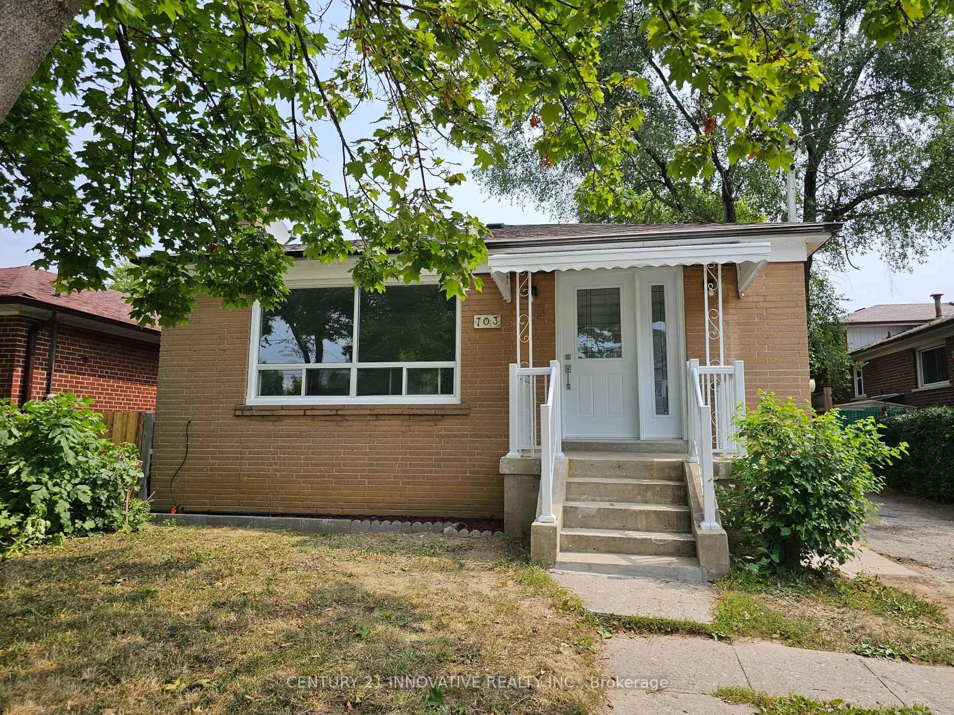 Home with brick exterior material, street for 703 Midland Ave, Toronto Ontario M1K 4E3