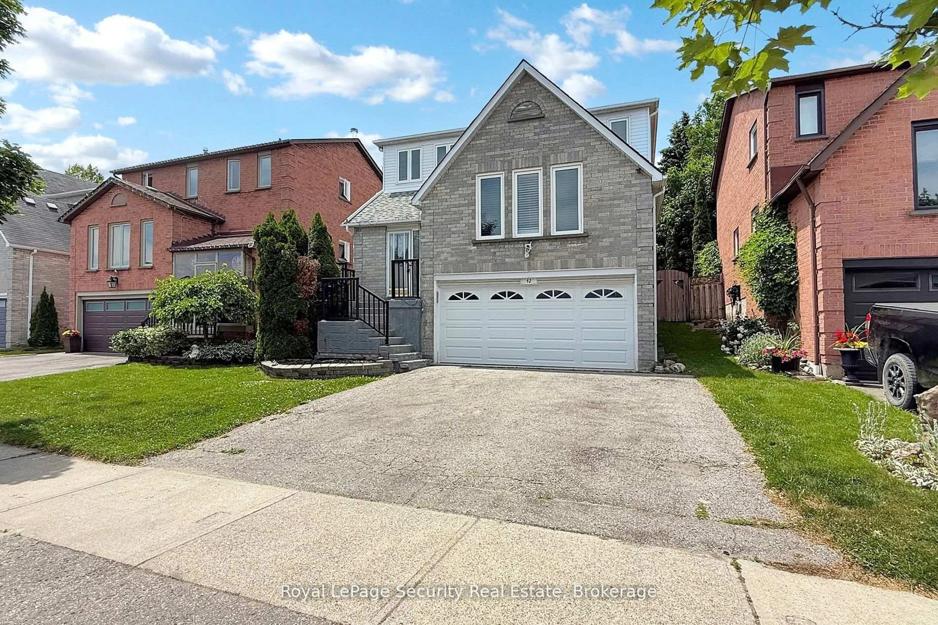 Home with brick exterior material, street for 42 Gardiner Dr, Ajax Ontario L1S 5Y3
