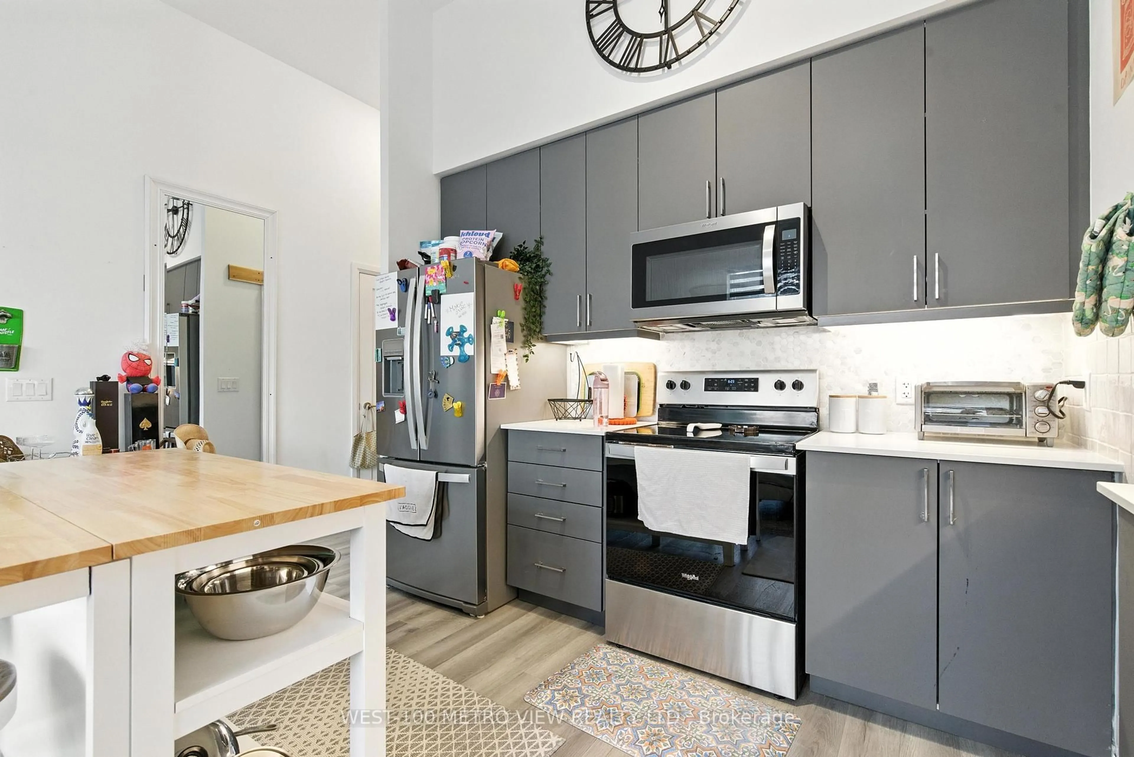 Open concept kitchen, ceramic/tile floor for 3220 Sheppard Ave #101, Toronto Ontario M1T 0B7