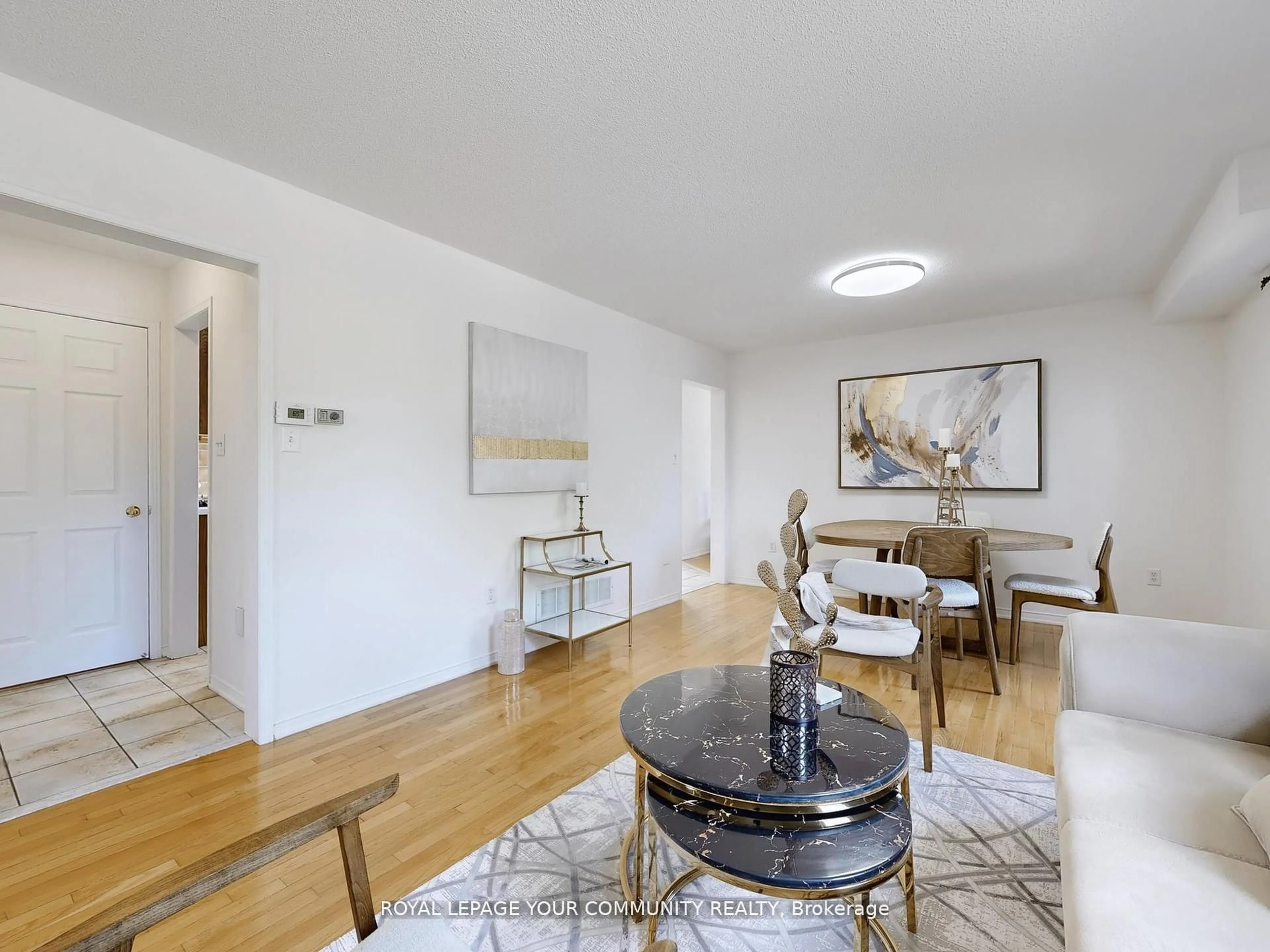 Living room with furniture, wood/laminate floor for 20 May Apple Terr, Toronto Ontario M1E 5J8