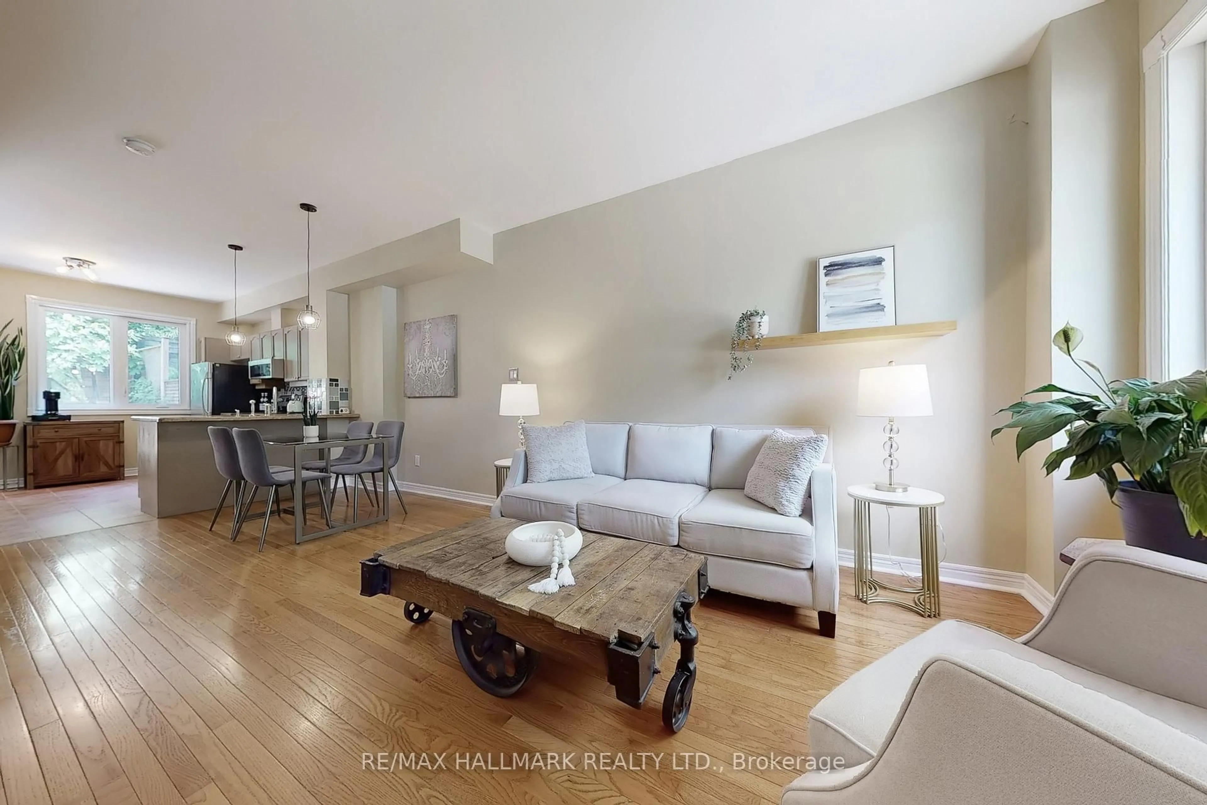 Living room with furniture, wood/laminate floor for 99 Goodwood Park Crt #12, Toronto Ontario M4C 5S9