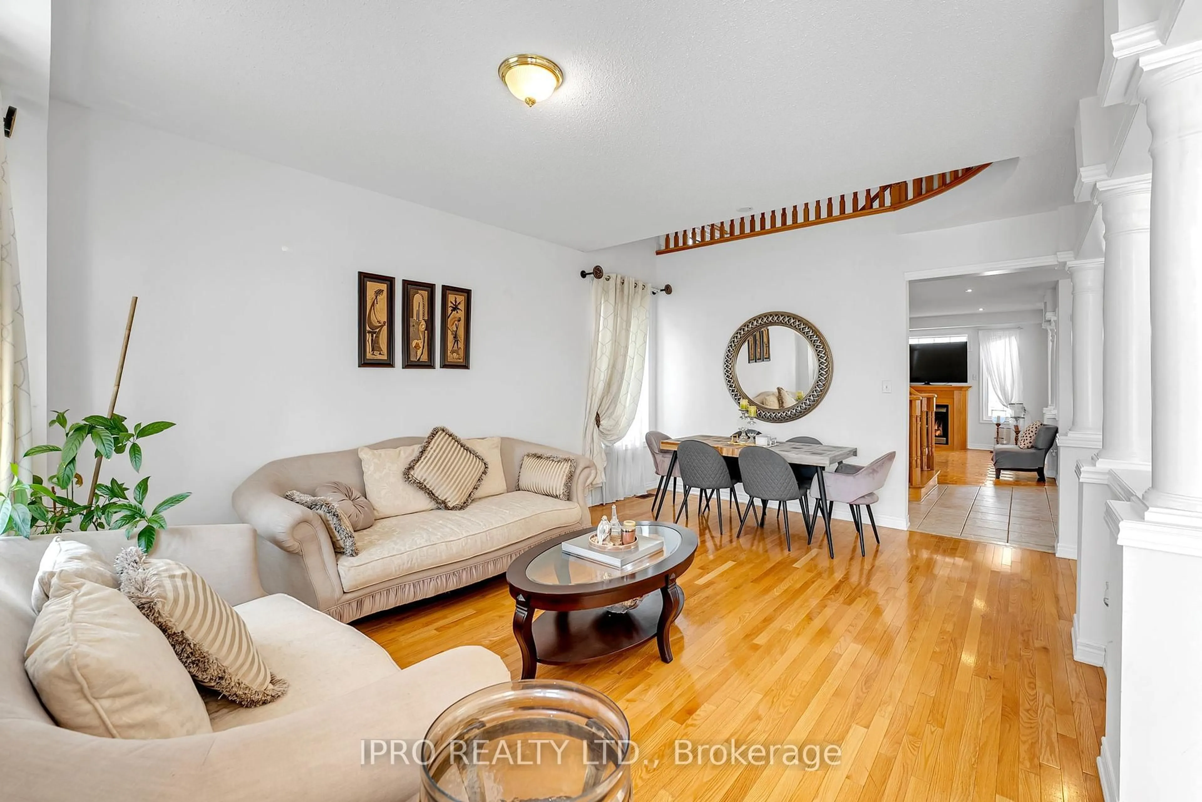 Living room with furniture, wood/laminate floor for 89 Bonnydon Cres, Toronto Ontario M1B 6H8