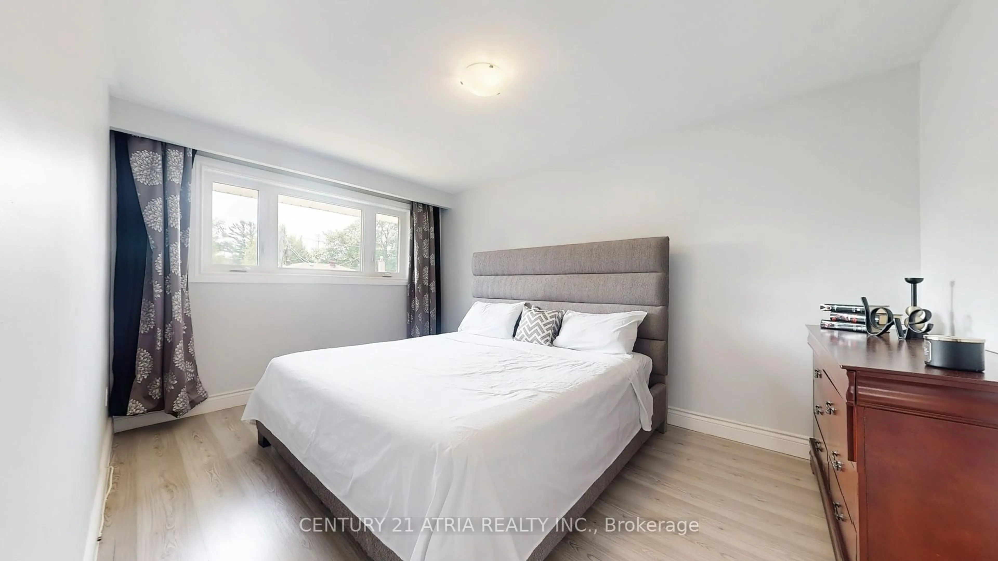 Bedroom with bed, wood/laminate floor for 82 Clementine Sq, Toronto Ontario M1G 2V7