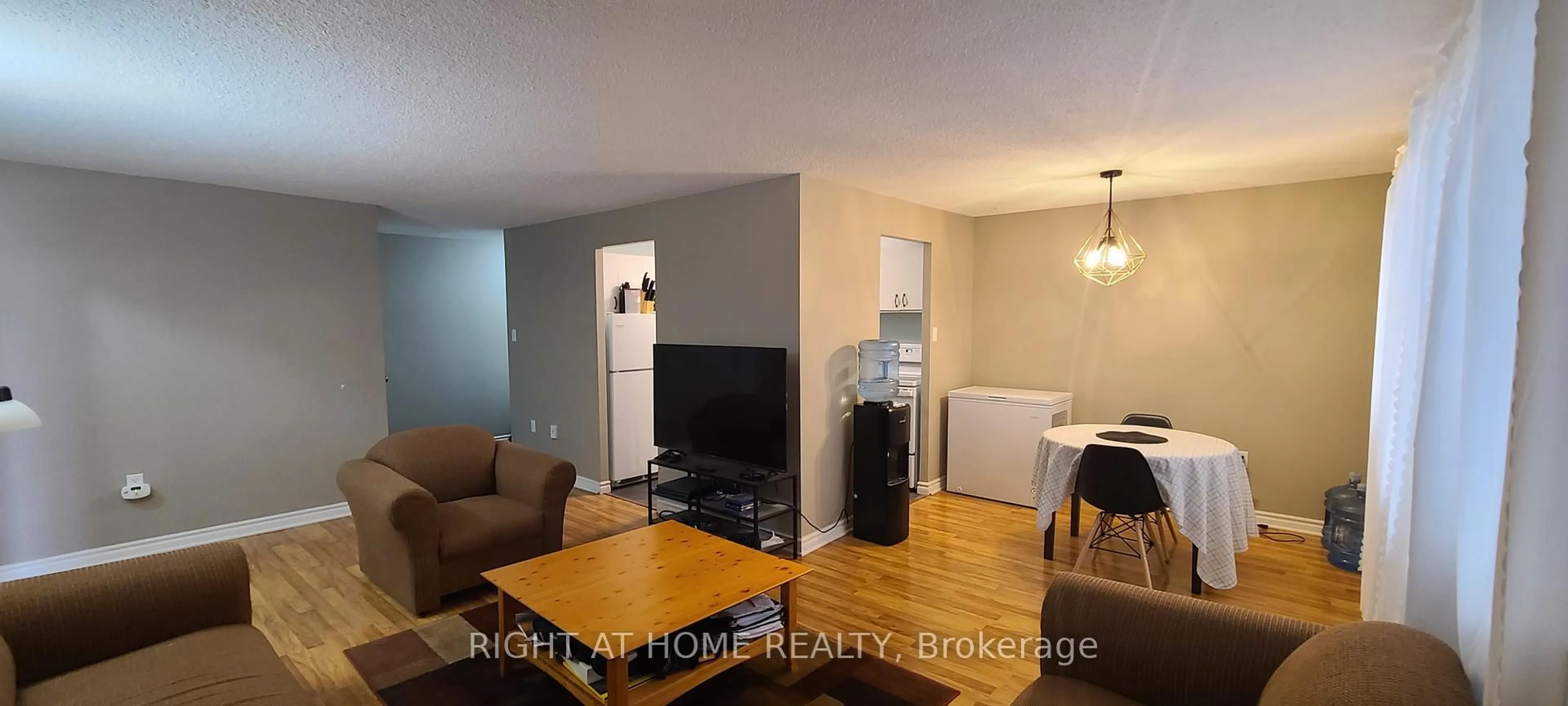 Living room with furniture, wood/laminate floor for 936 Glen St #414, Oshawa Ontario L1J 5Z7