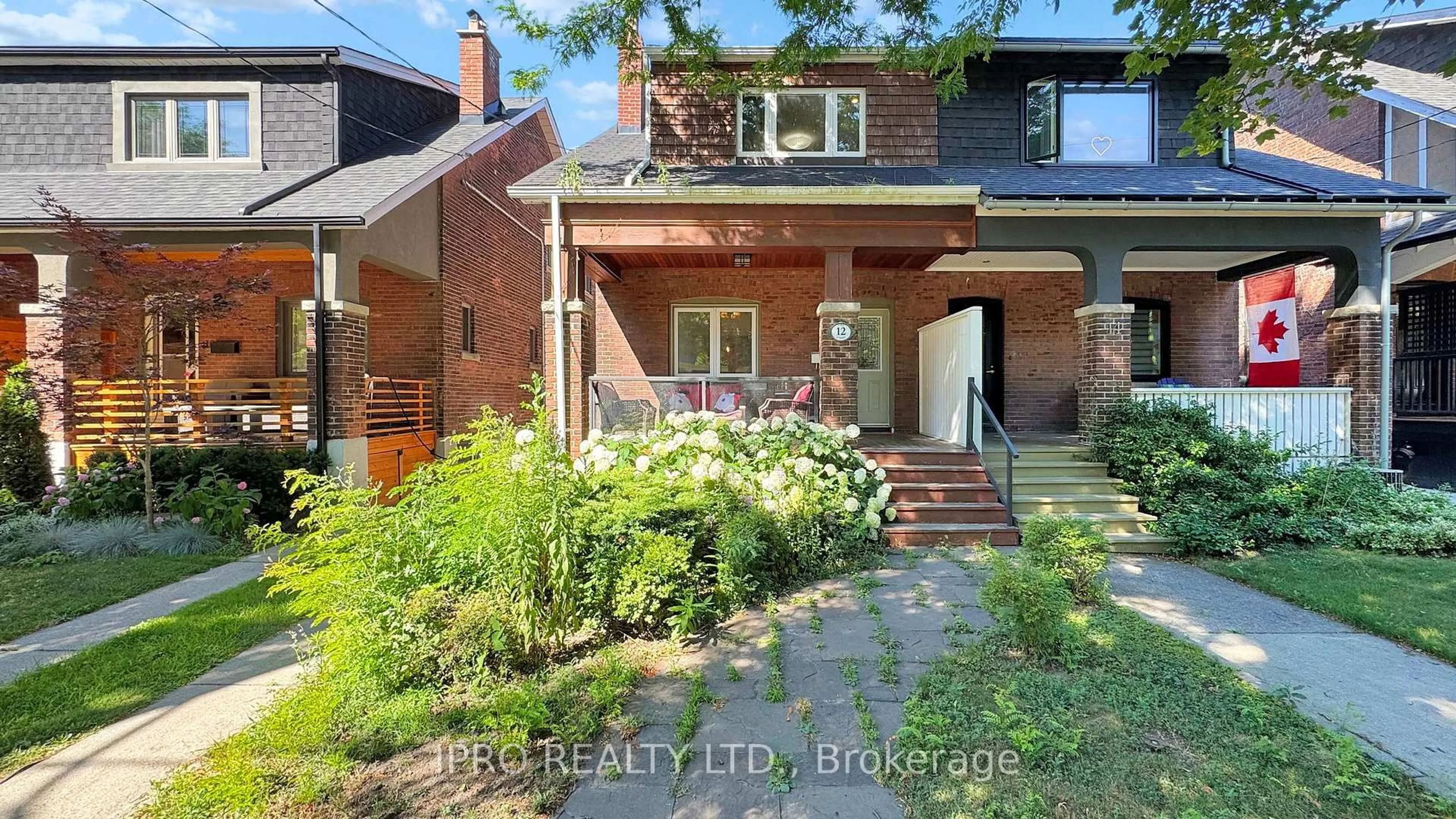 Home with brick exterior material, street for 12 Lark St, Toronto Ontario M4L 3M6