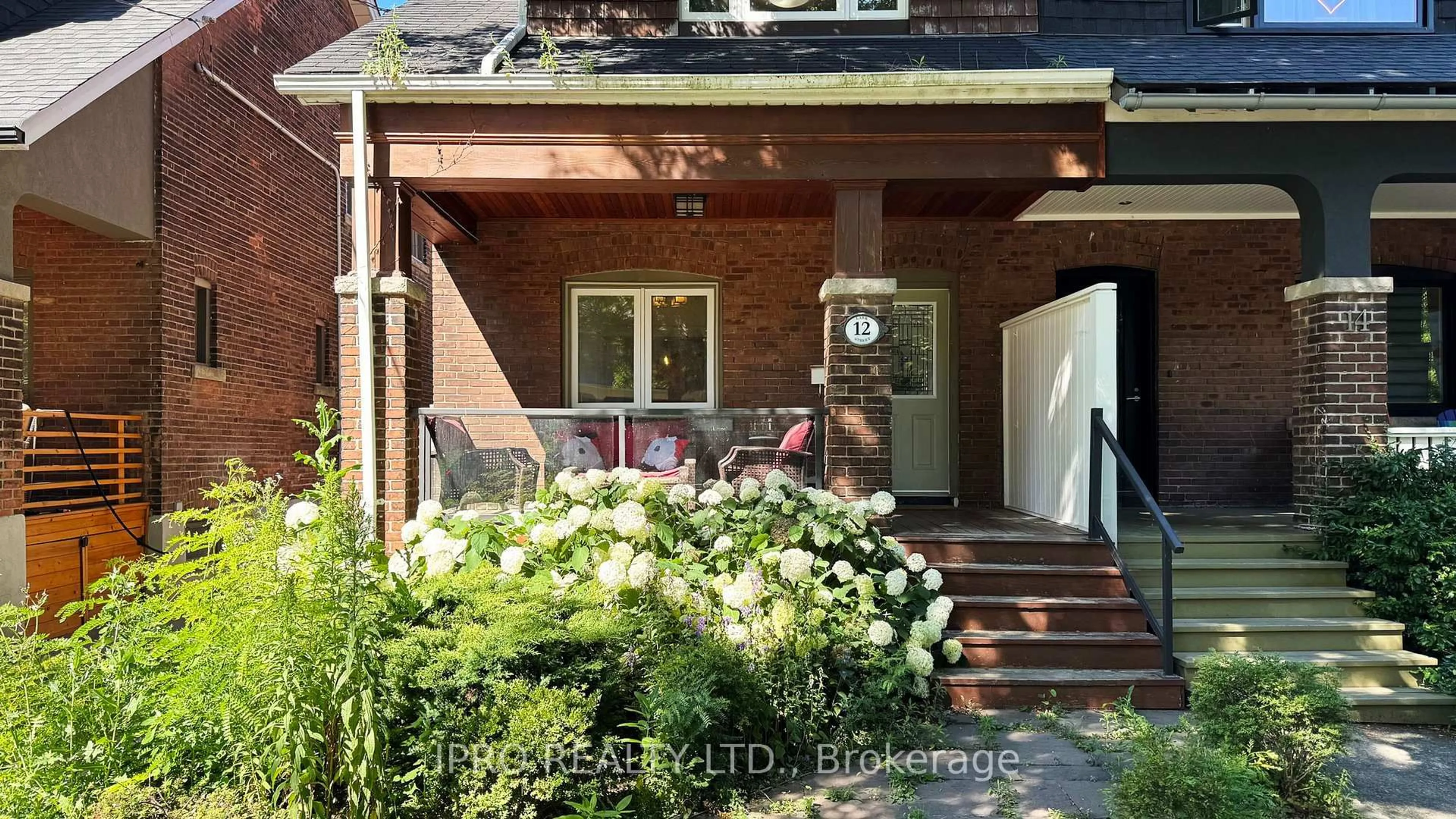 Home with brick exterior material, street for 12 Lark St, Toronto Ontario M4L 3M6