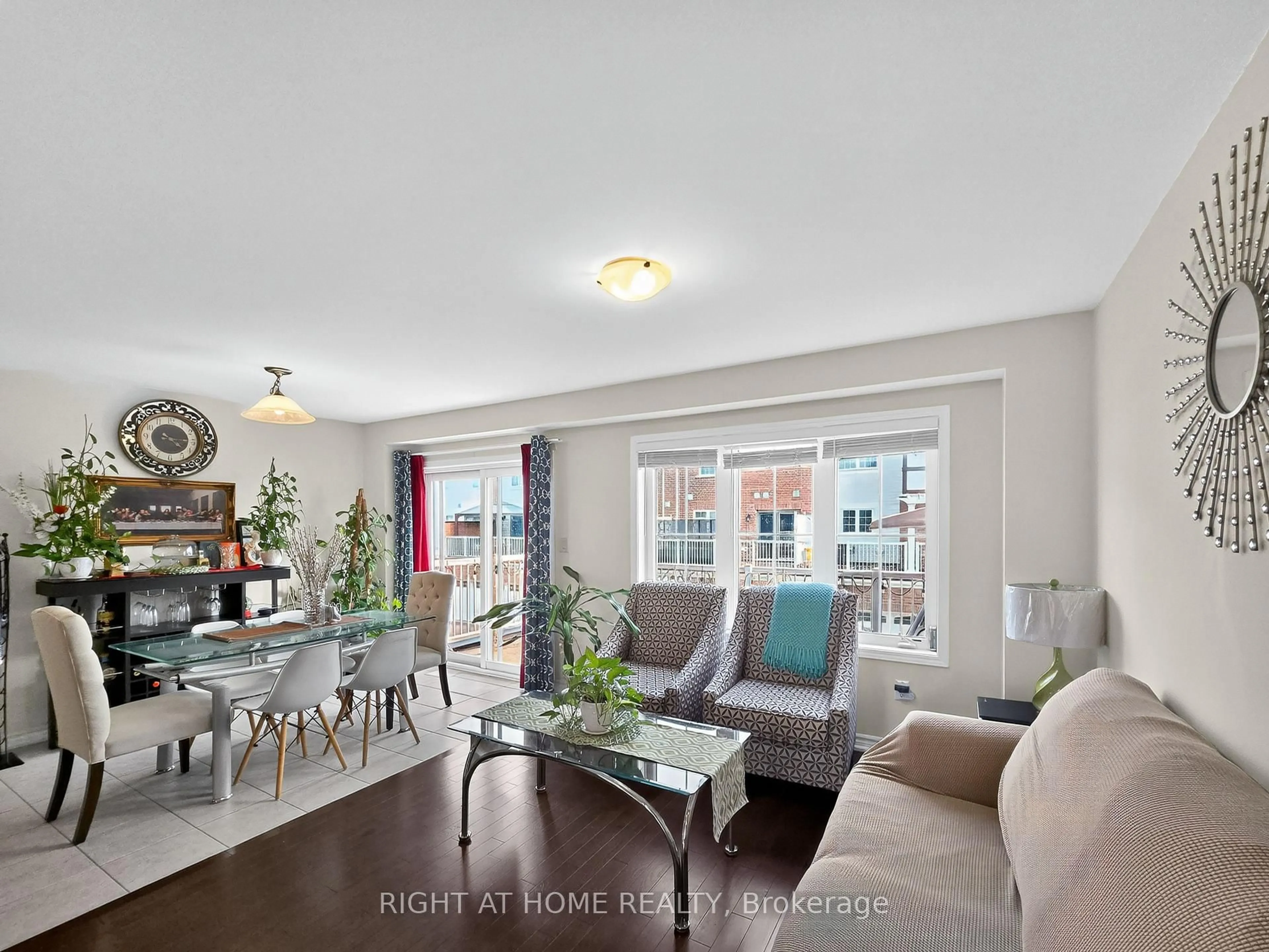 Living room with furniture, wood/laminate floor for 77 Whitefish St, Whitby Ontario L1P 0E4