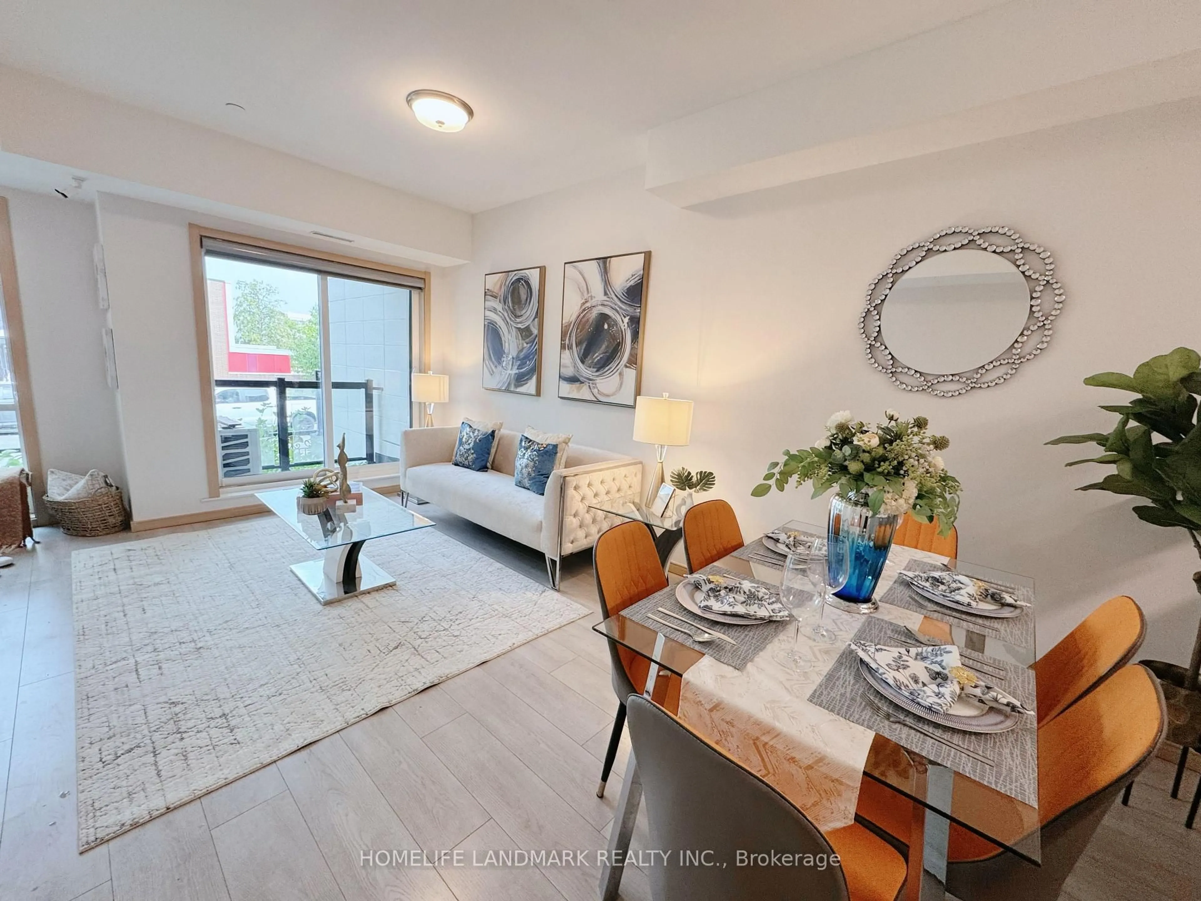 Living room with furniture, wood/laminate floor for 200 Chester Le Blvd #D207, Toronto Ontario M1W 0A9