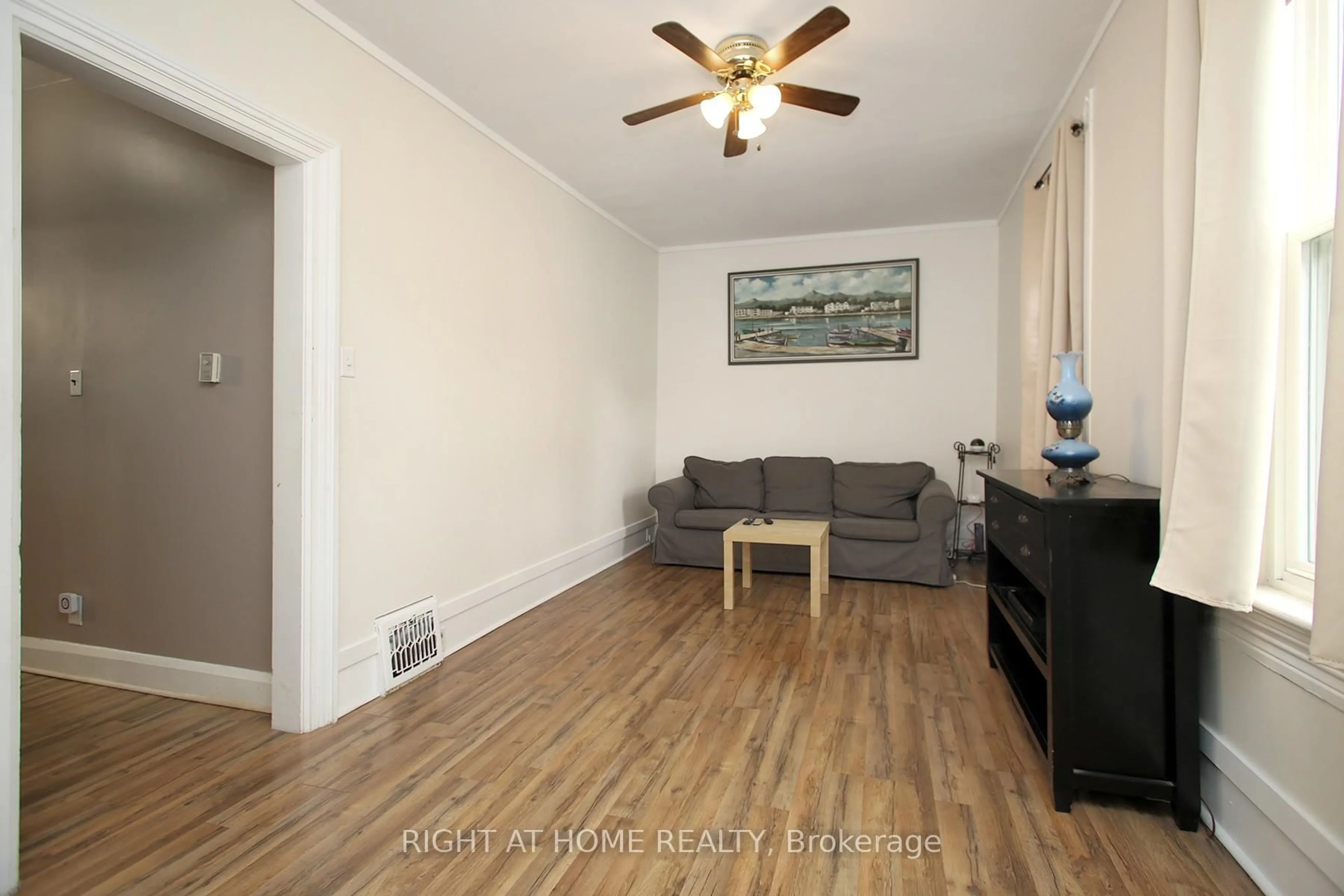 Living room with furniture, wood/laminate floor for 217 Celina St, Oshawa Ontario L1H 4N7