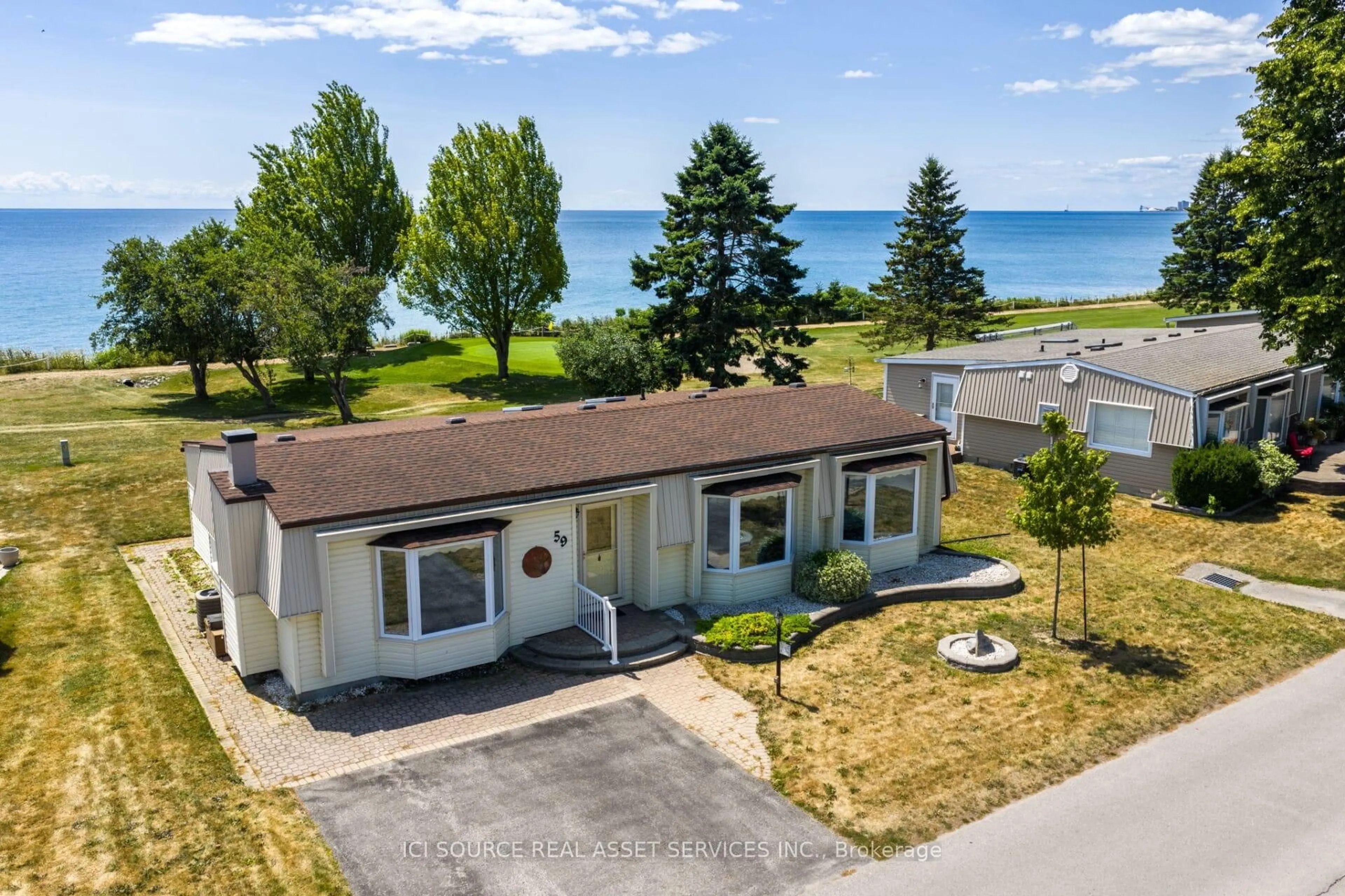 A pic from outside/outdoor area/front of a property/back of a property/a pic from drone, water/lake/river/ocean view for 59 The Cove Rd, Clarington Ontario L1B 1B2