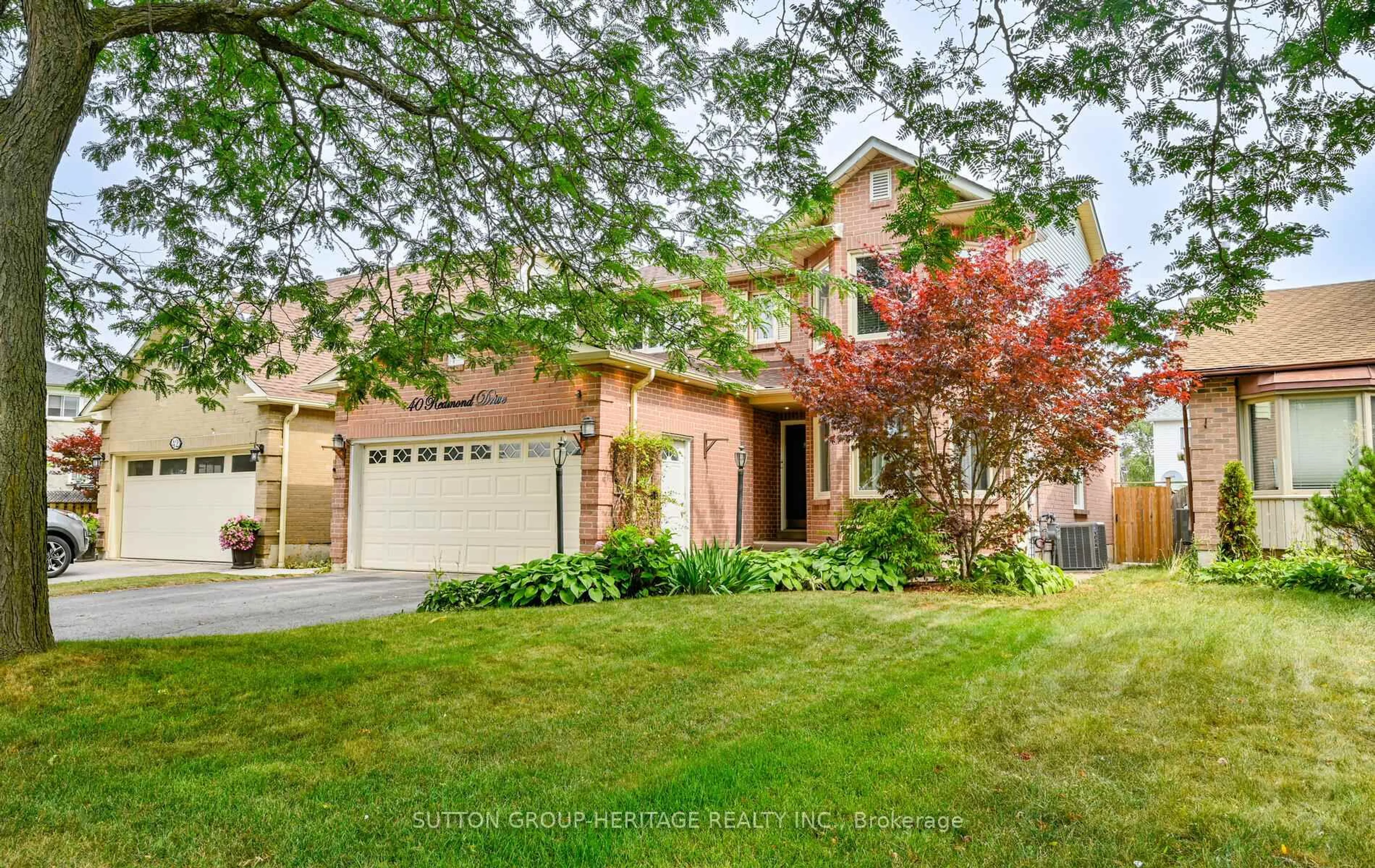 Home with brick exterior material, street for 40 Redmond Dr, Ajax Ontario L1S 6T8