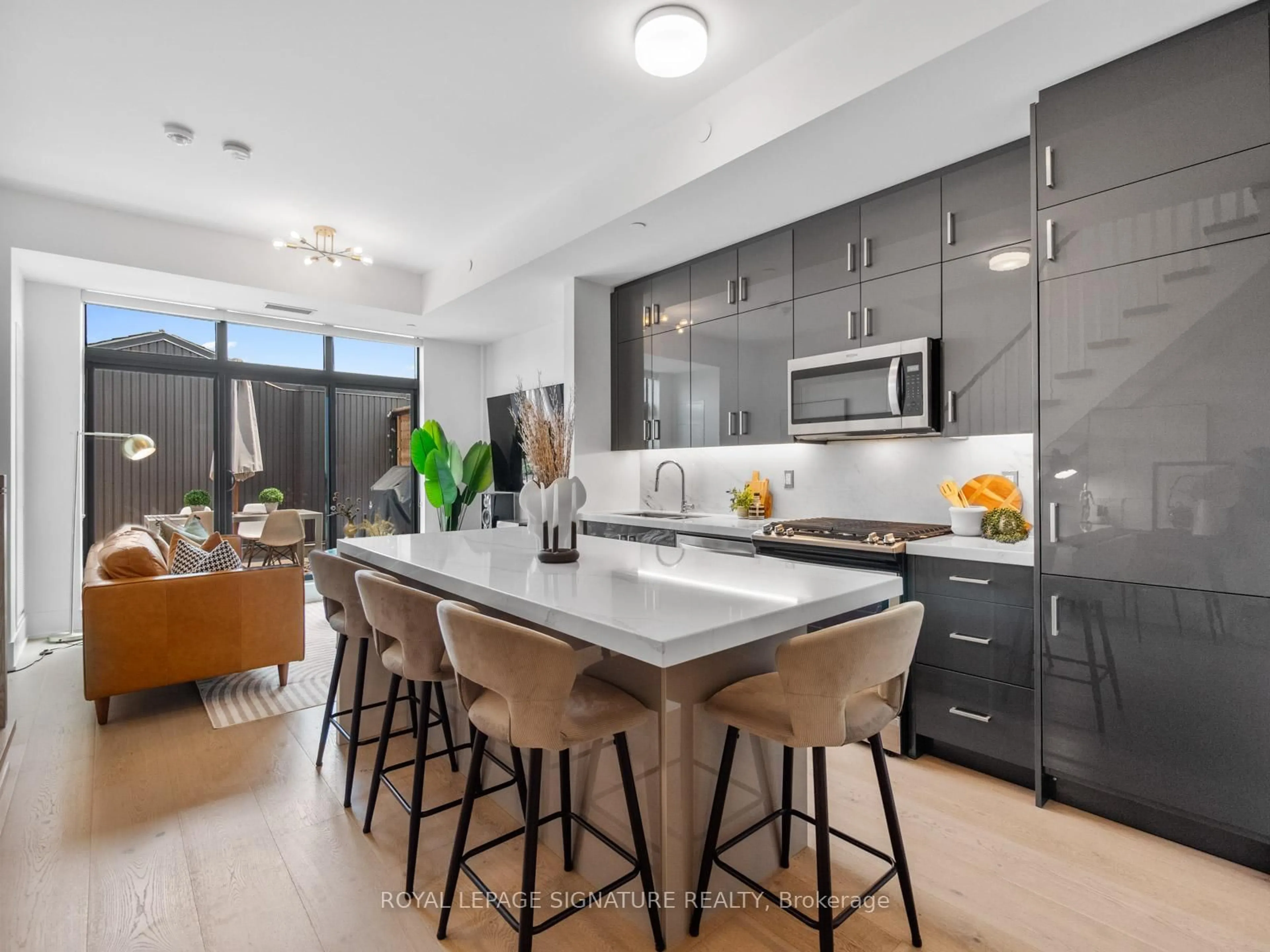 Open concept kitchen, ceramic/tile floor for 14 Dewhurst Blvd #406, Toronto Ontario M4J 3H9