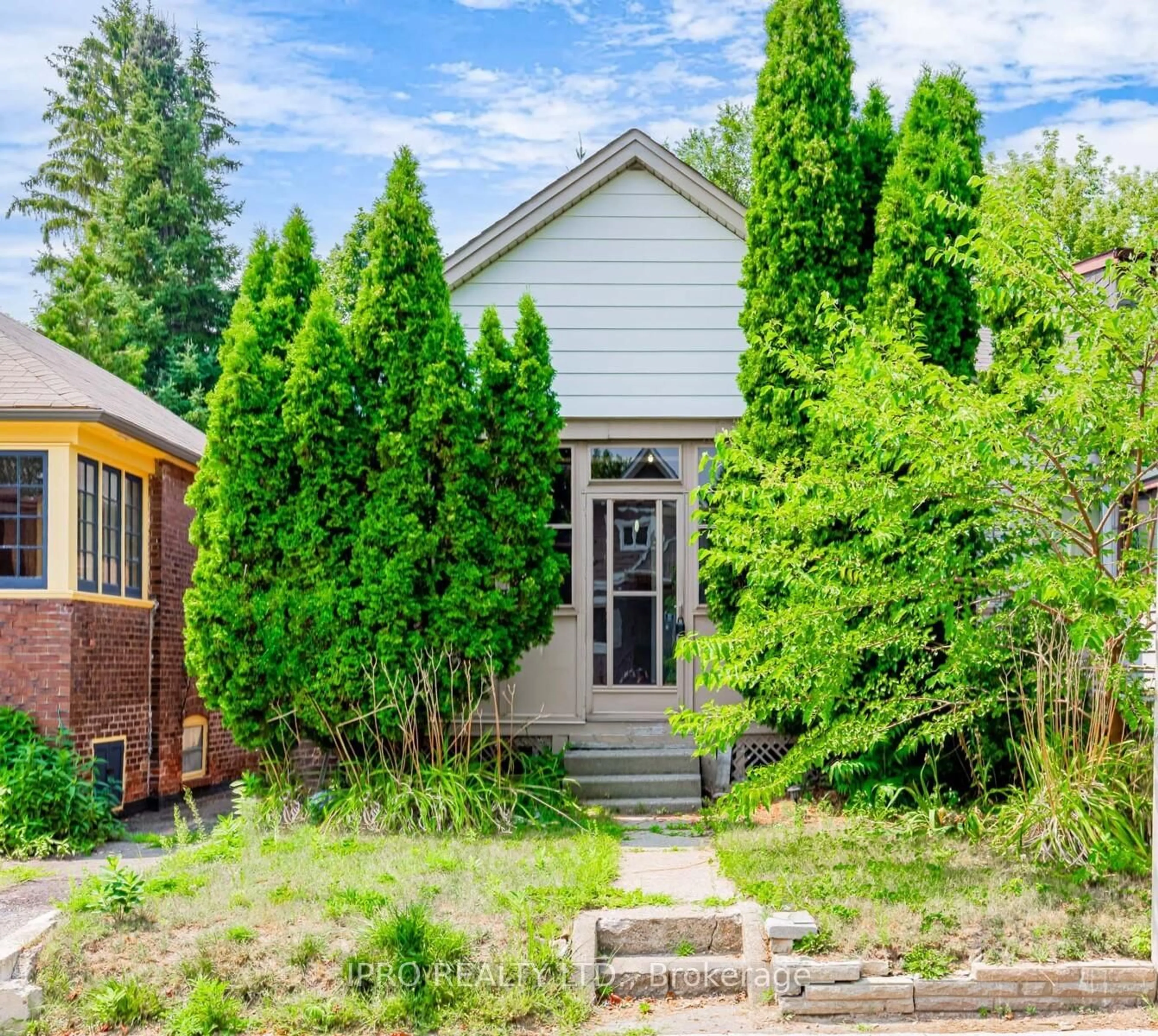 Home with brick exterior material, street for 244 King Edward Ave, Toronto Ontario M4C 5K1