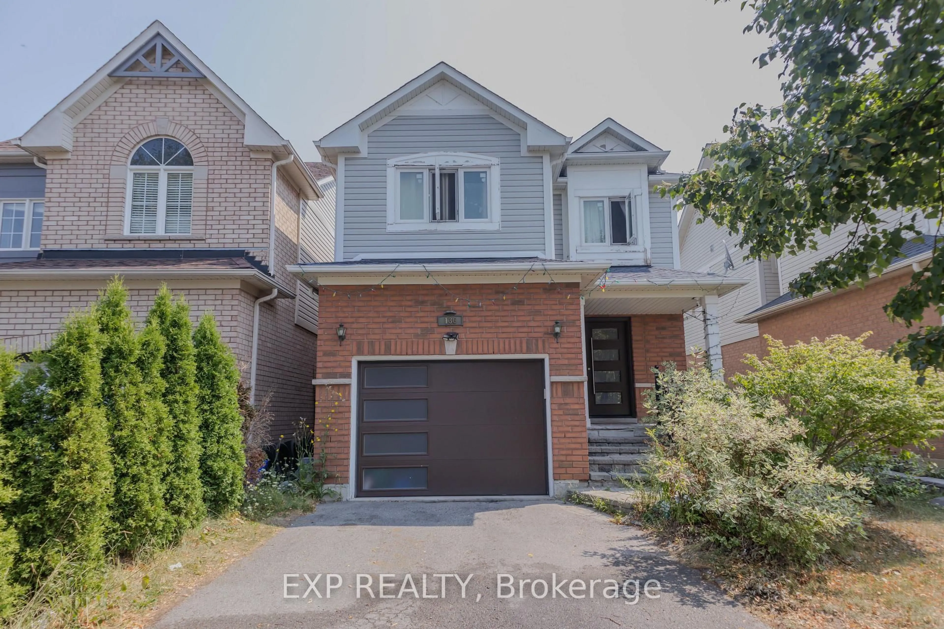 Home with brick exterior material, street for 136 Kirkland Pl, Whitby Ontario L1P 1X2