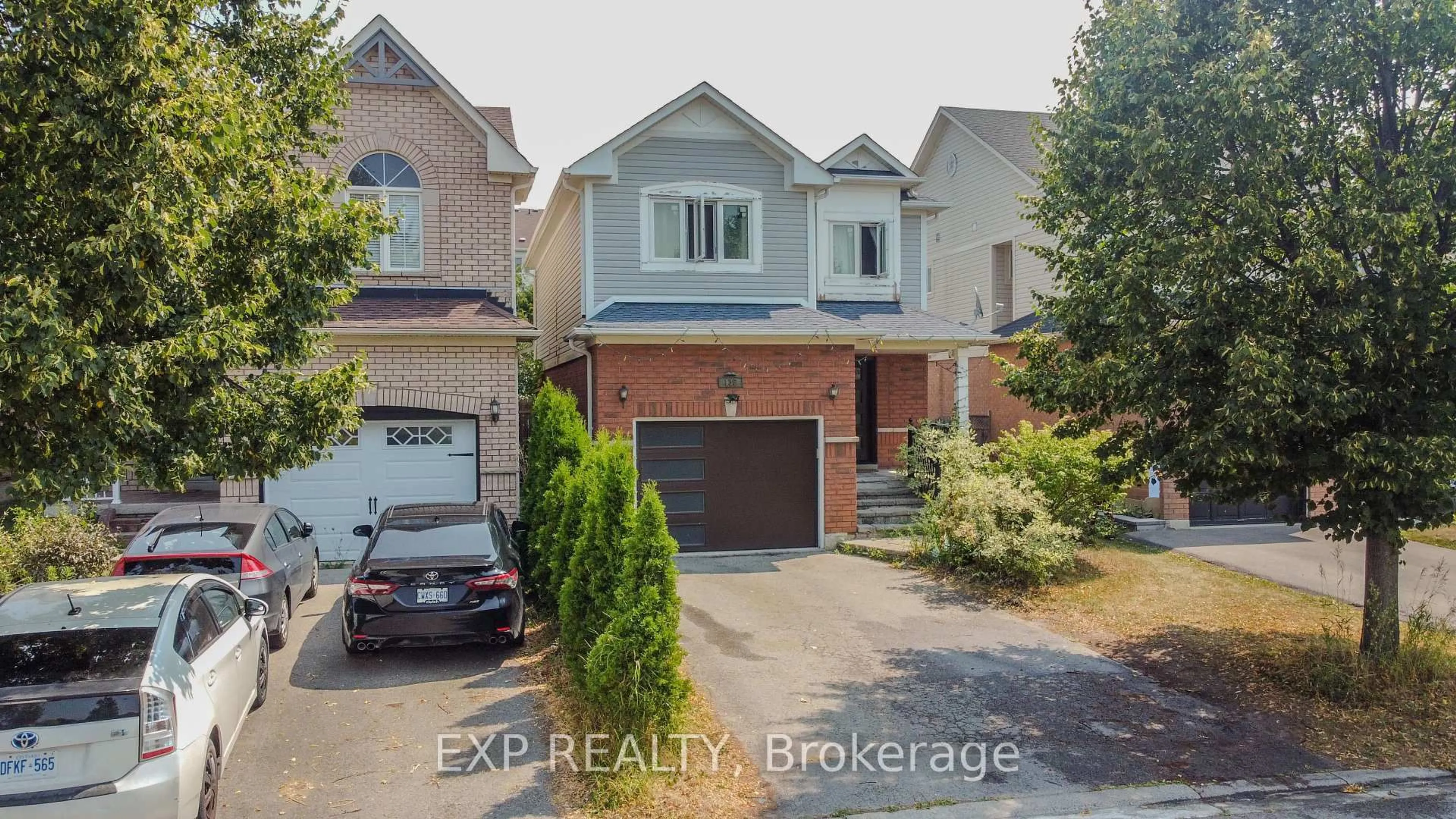 Home with brick exterior material, street for 136 Kirkland Pl, Whitby Ontario L1P 1X2