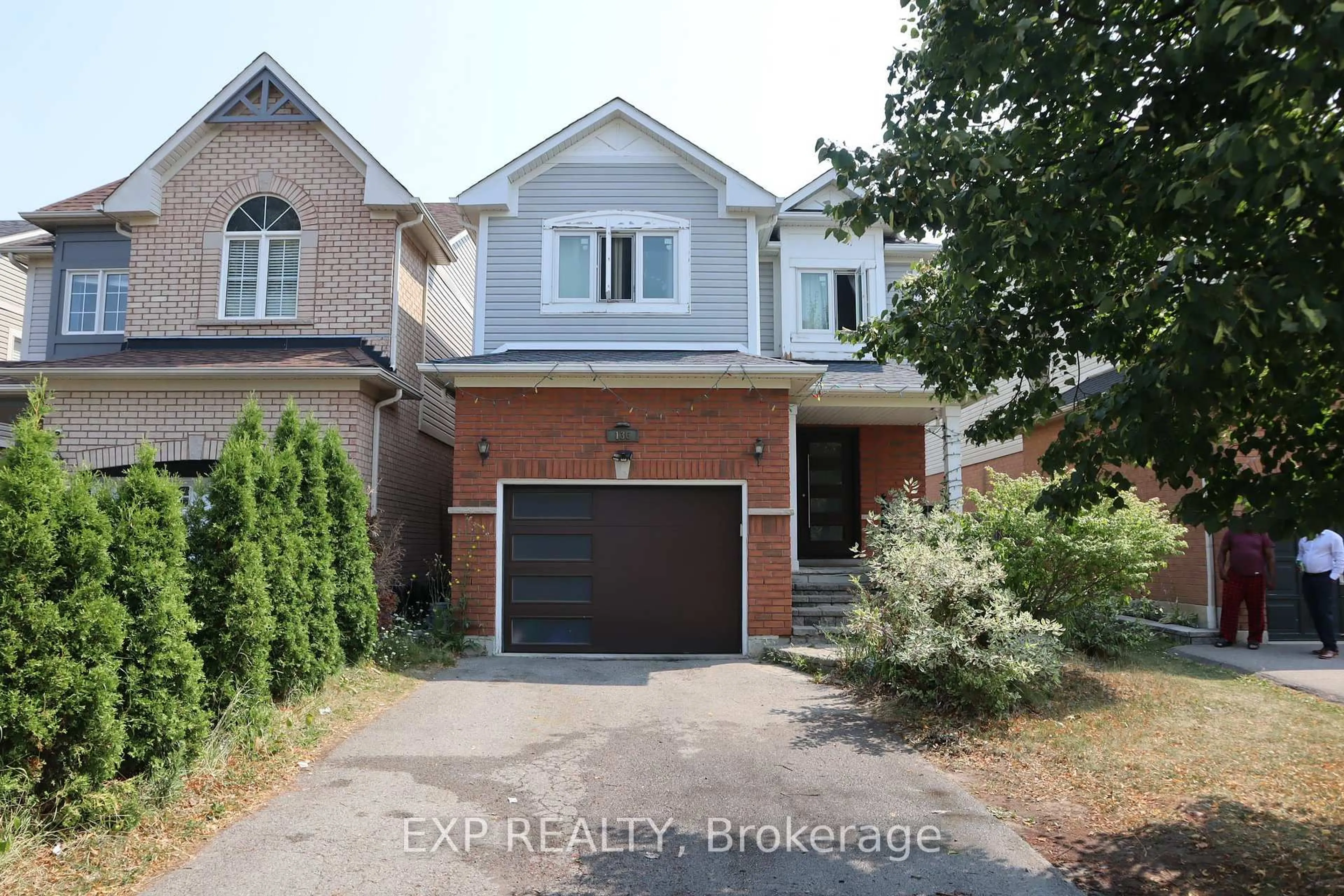 Home with brick exterior material, street for 136 Kirkland Pl, Whitby Ontario L1P 1X2
