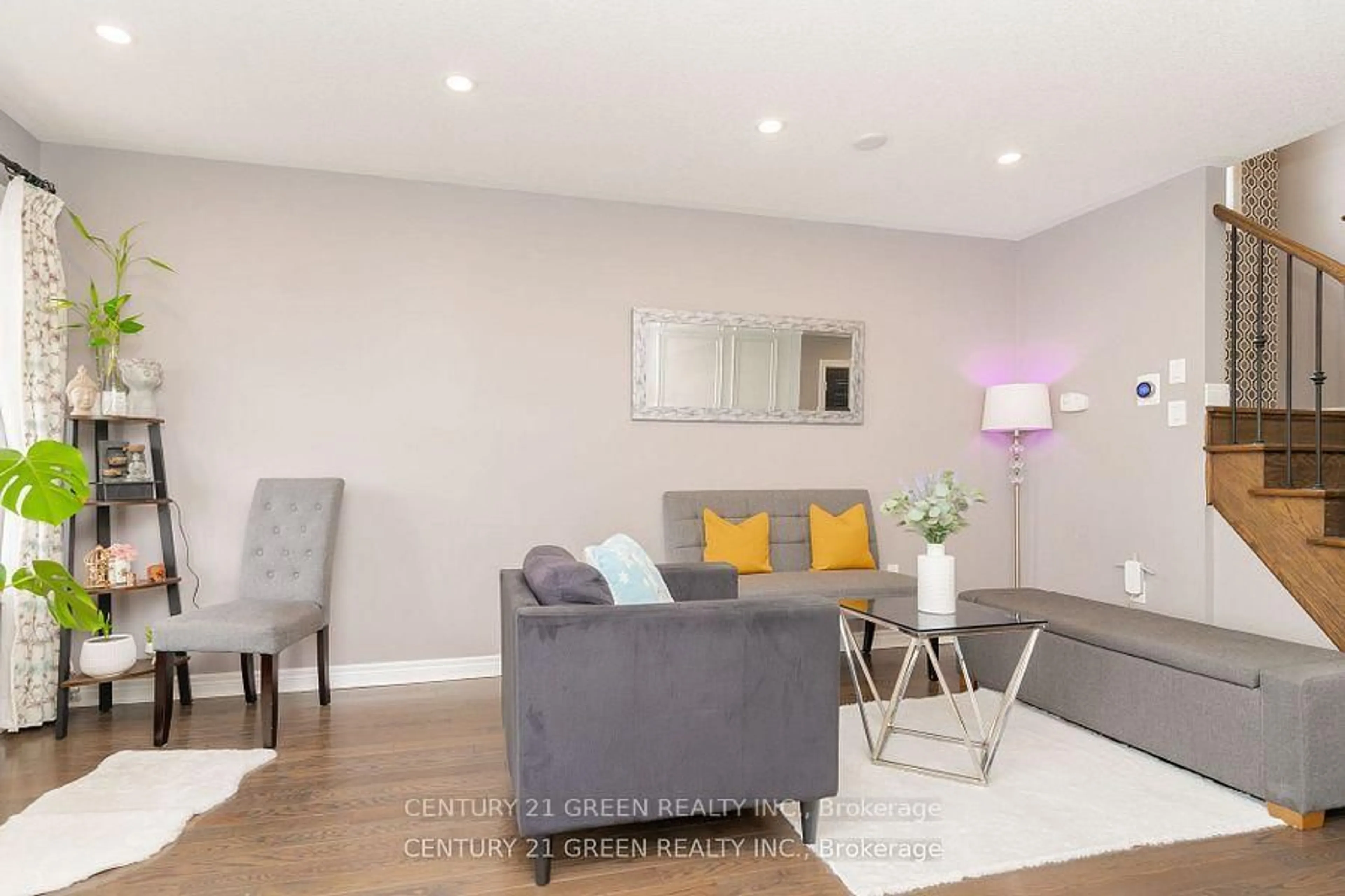 Living room with furniture, wood/laminate floor for 94 Snowling Dr, Ajax Ontario L1Z 0G4