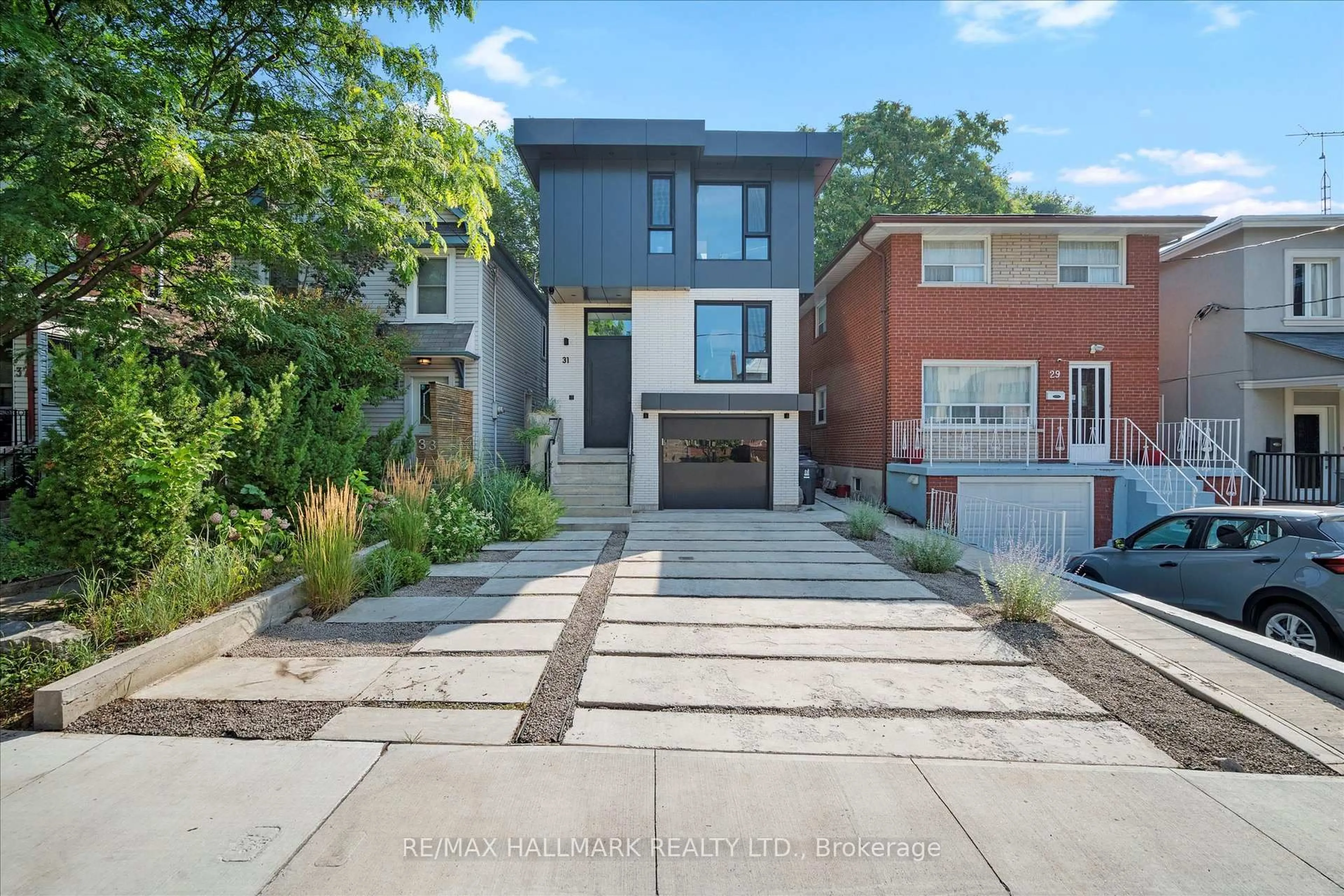 Home with brick exterior material, street for 31 Redwood Ave, Toronto Ontario M4L 2S5
