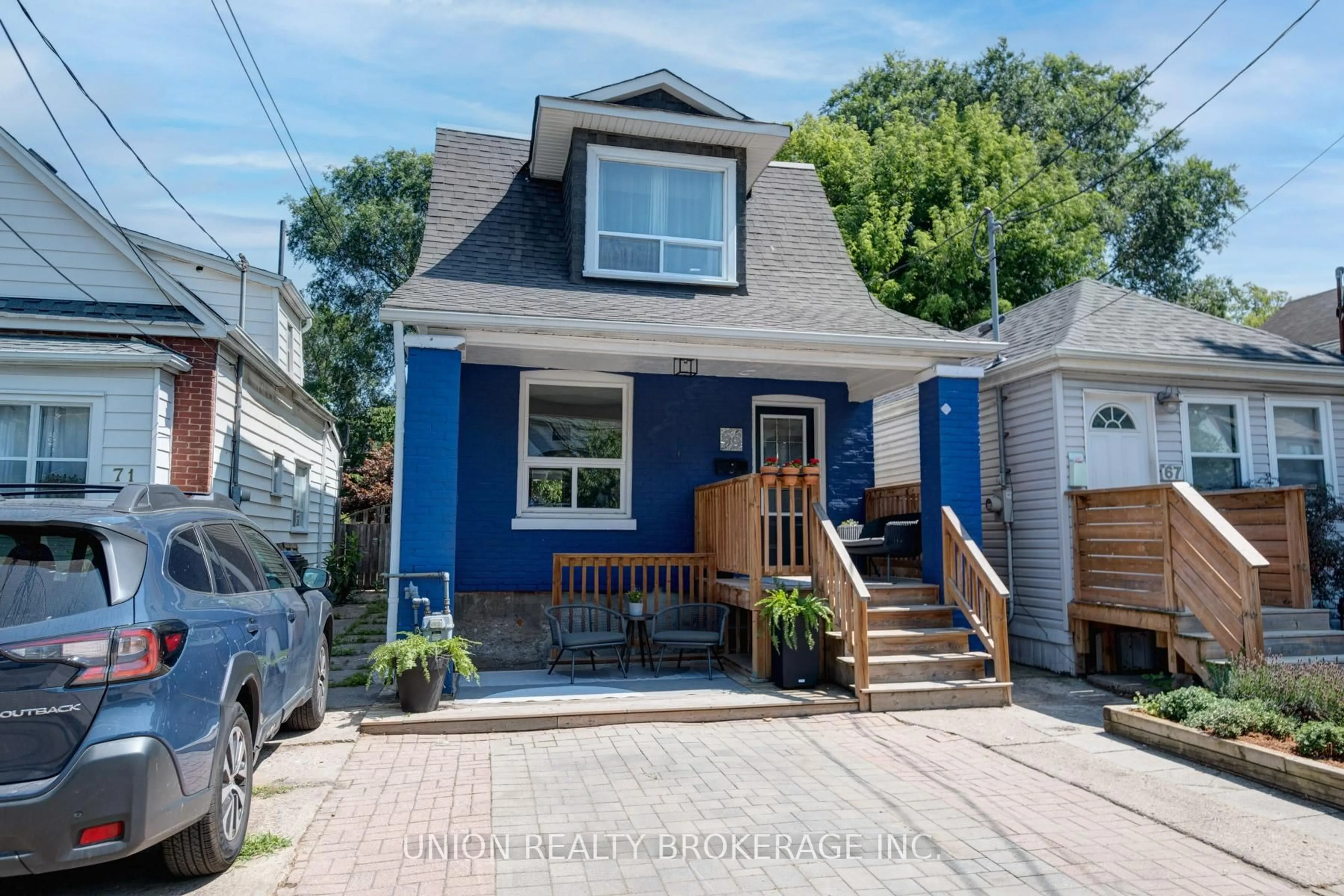 Home with vinyl exterior material, street for 69 King Edward Ave, Toronto Ontario M4C 5J5