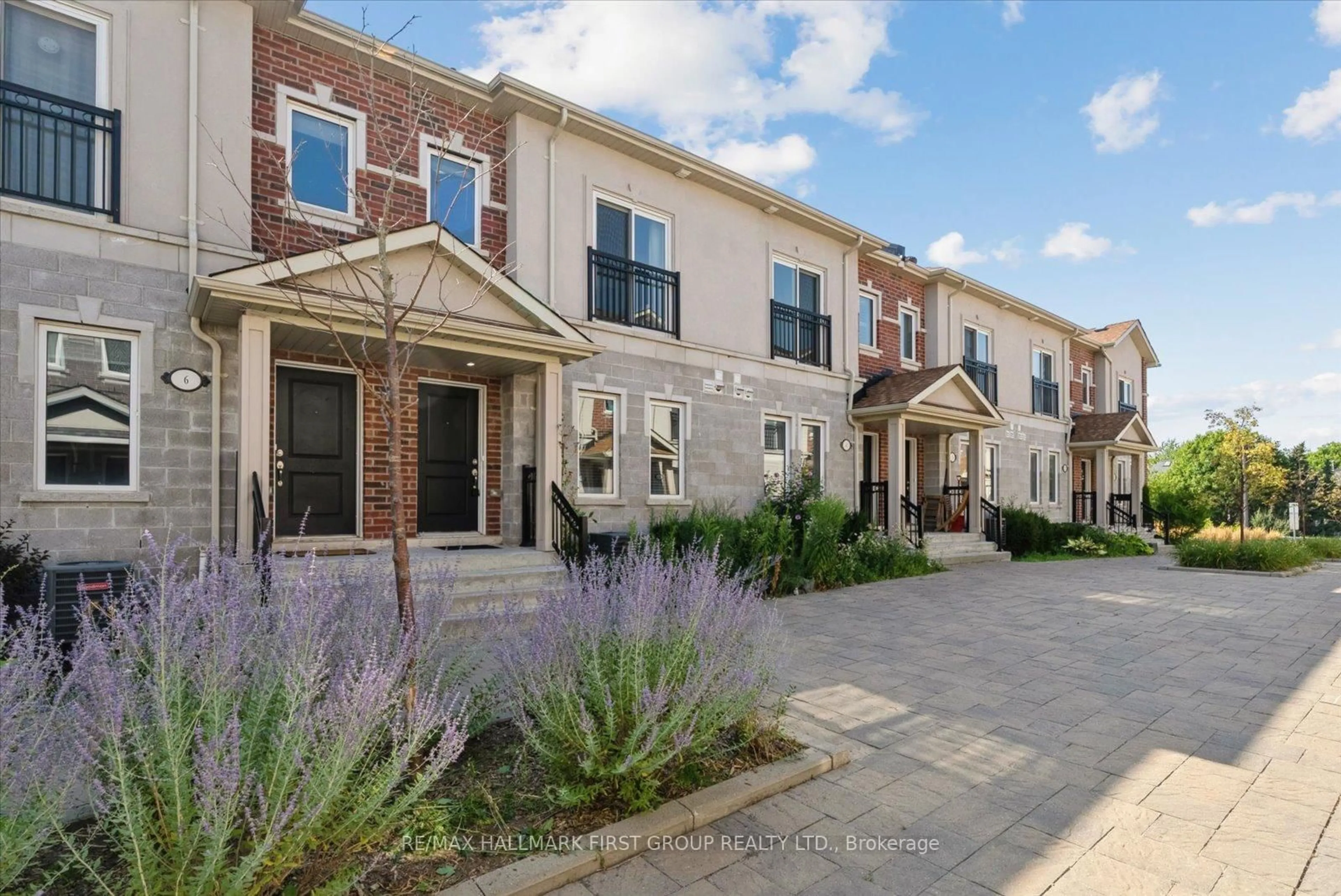 Home with brick exterior material, street for 1060 St. Hilda's Way #5, Whitby Ontario L1N 0L3
