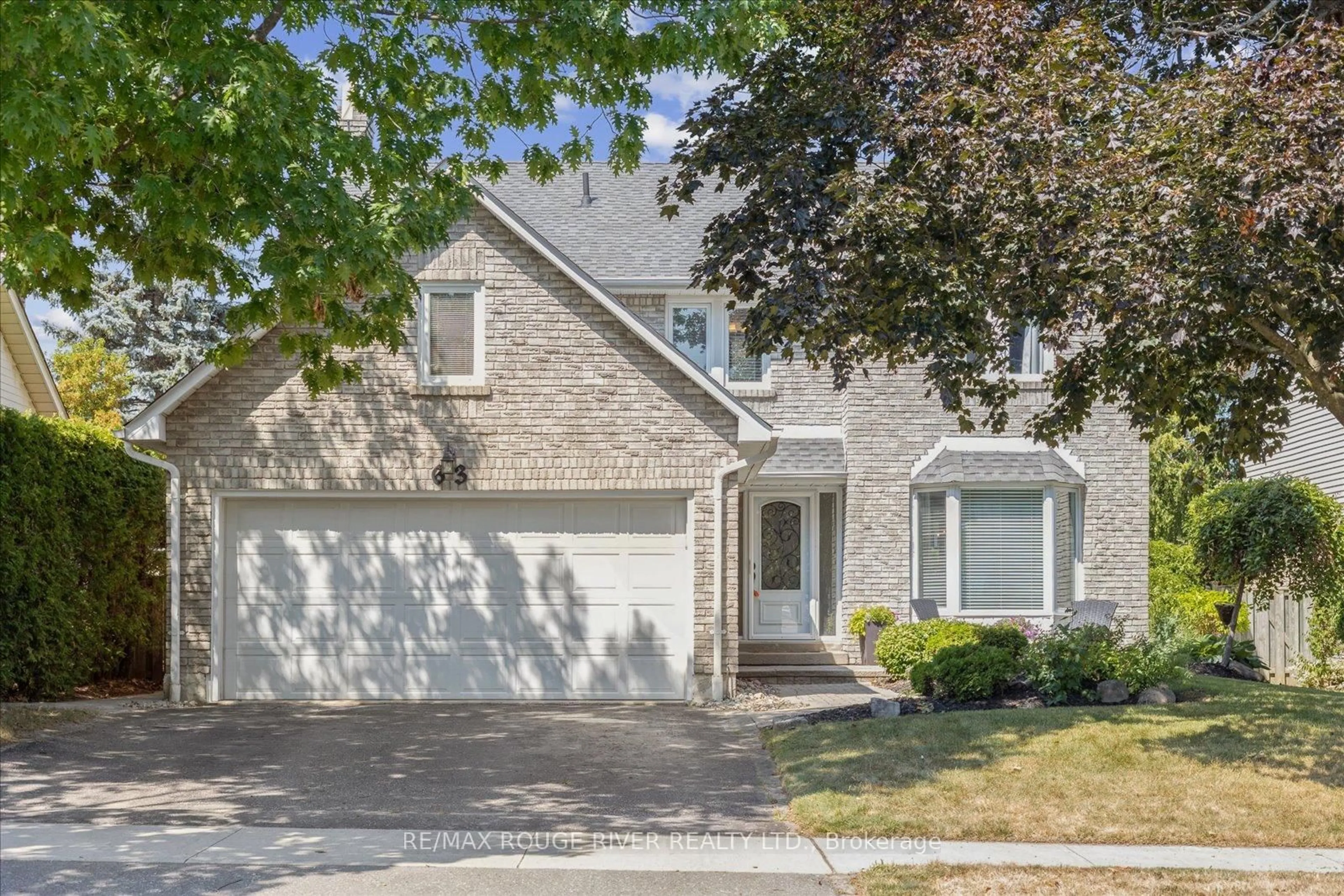 Home with brick exterior material, street for 63 Canadians Oaks Dr, Whitby Ontario L1N 6W9