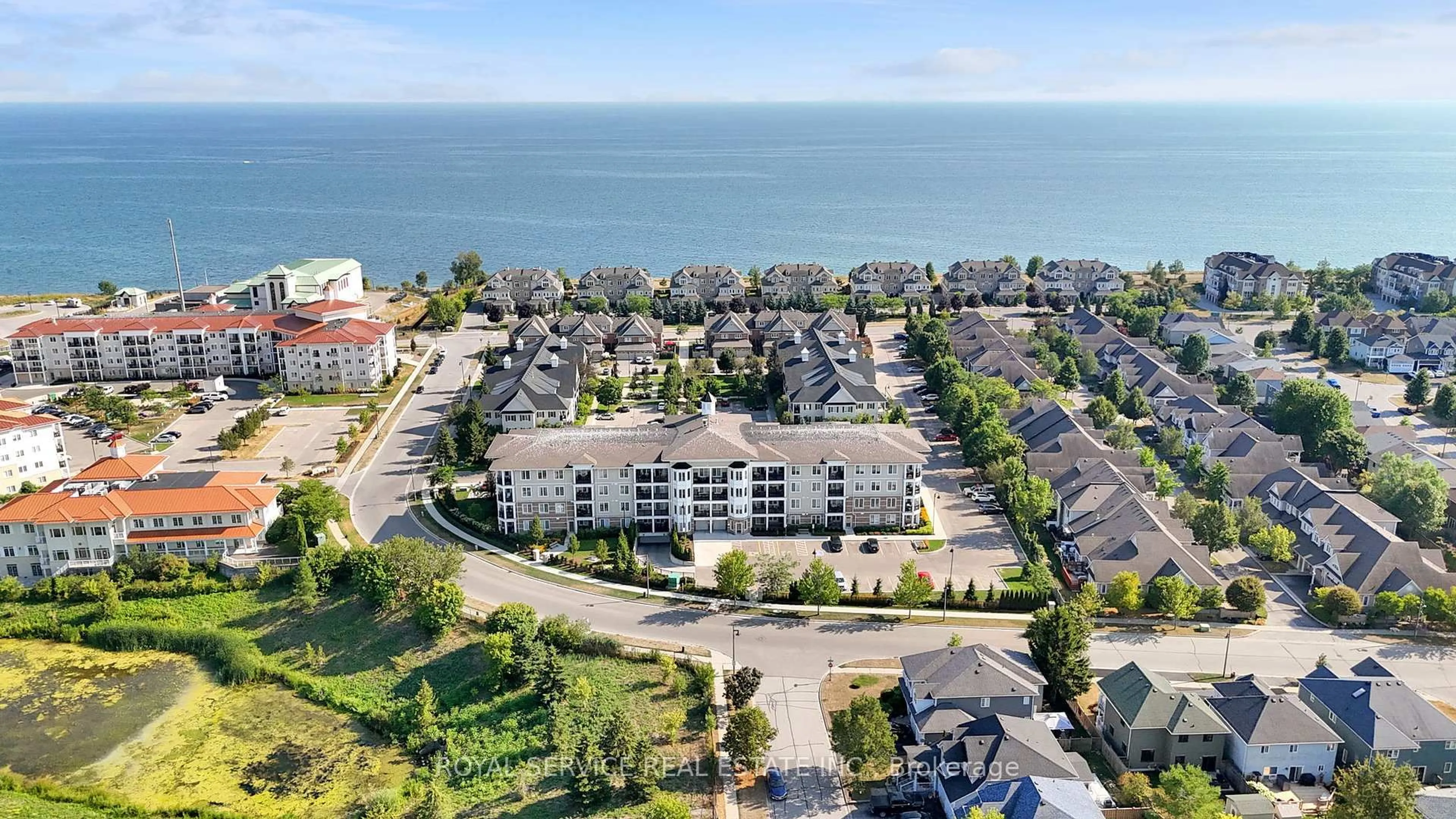 A pic from outside/outdoor area/front of a property/back of a property/a pic from drone, water/lake/river/ocean view for 65 Shipway Ave #404, Clarington Ontario L1B 0W2