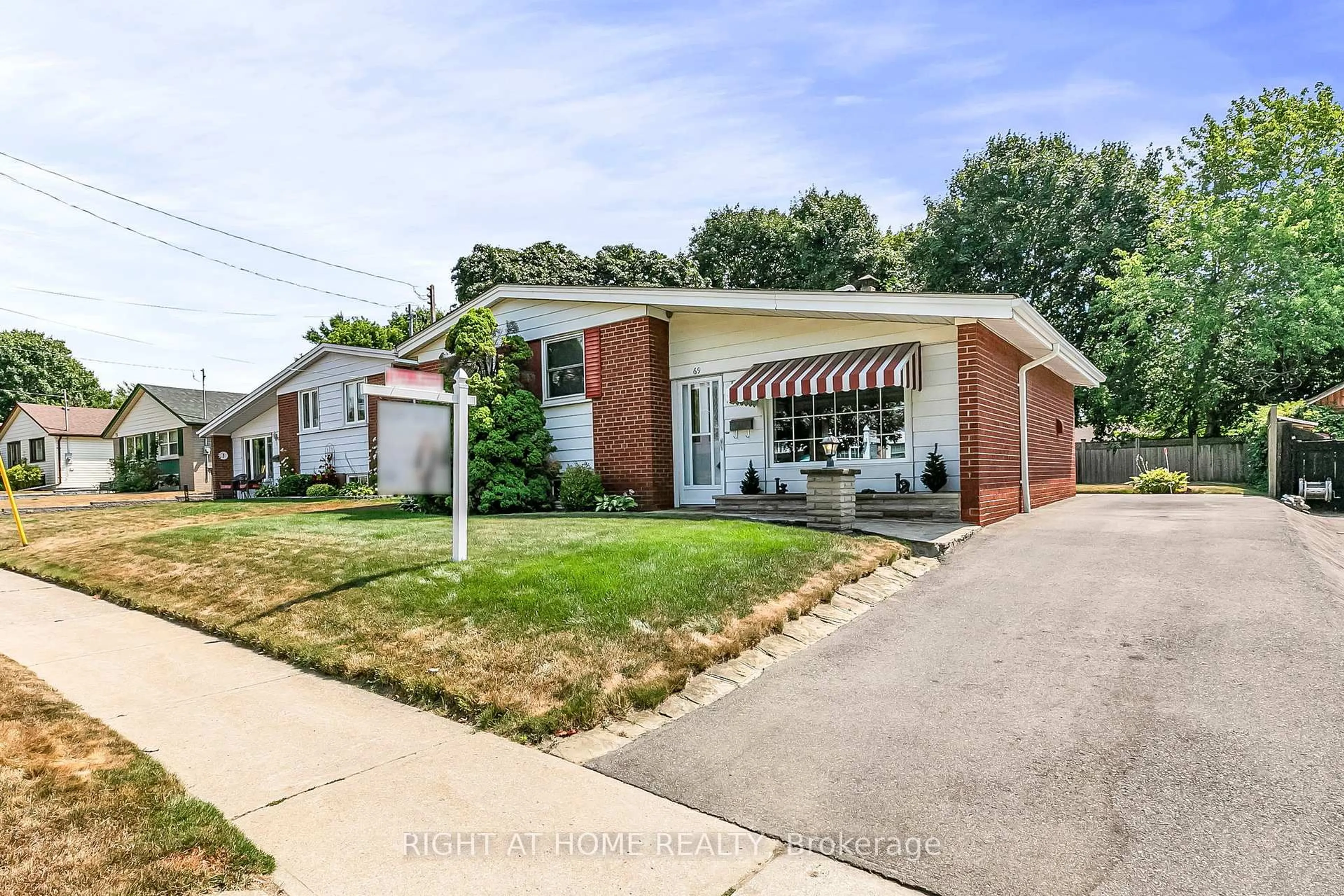 Home with brick exterior material, street for 69 Benleigh Dr, Toronto Ontario M1H 1J4