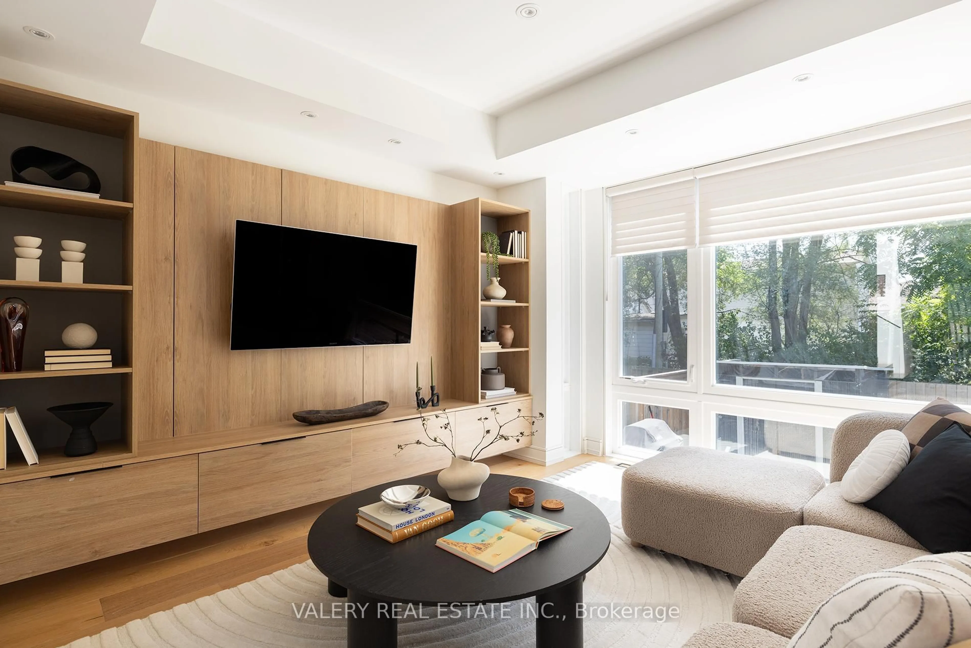 Living room with furniture, wood/laminate floor for 83 Virginia Ave, Toronto Ontario M4C 2S8