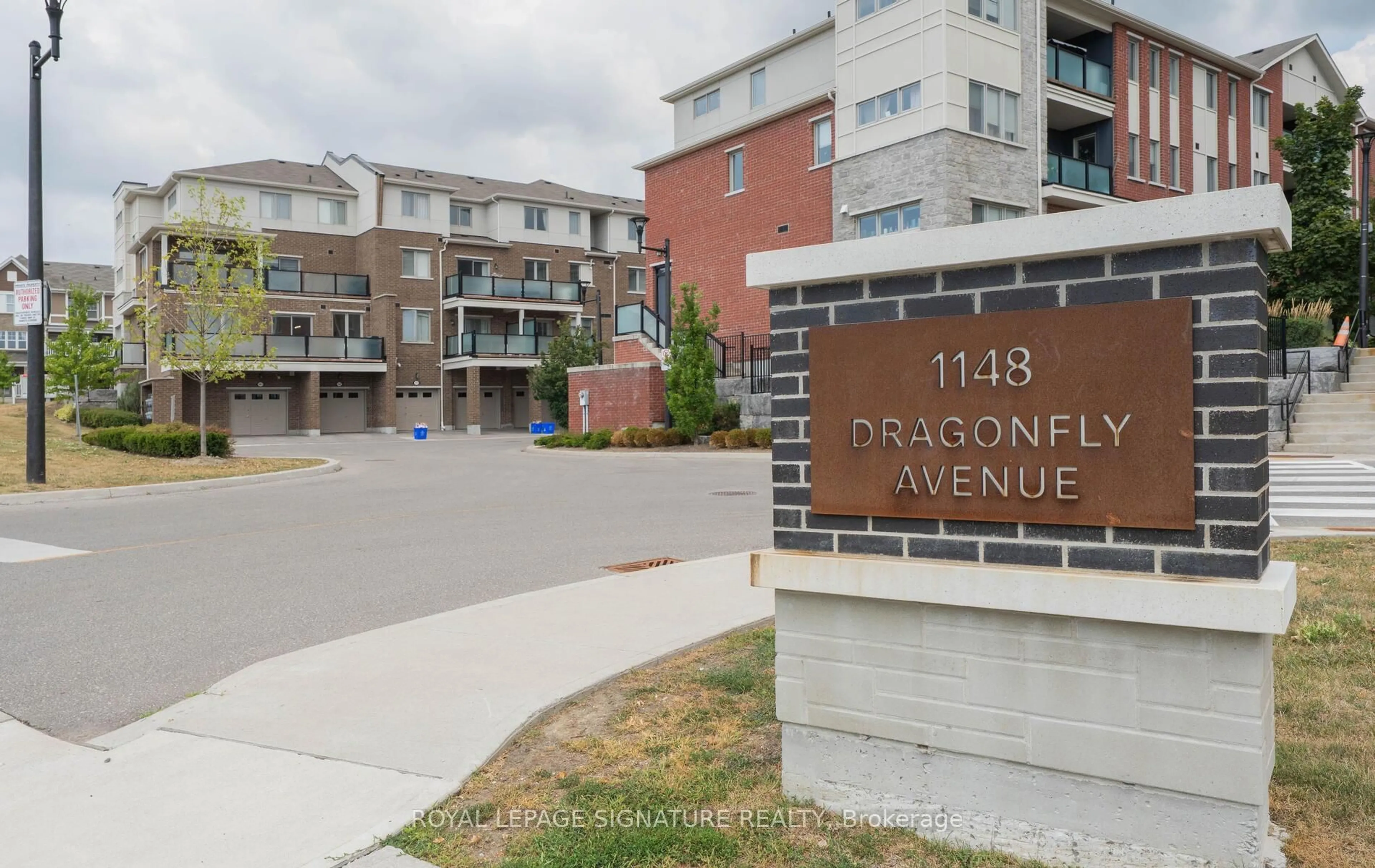 A pic from outside/outdoor area/front of a property/back of a property/a pic from drone, street for 1148 Dragonfly Ave #101, Pickering Ontario L1X 0H5
