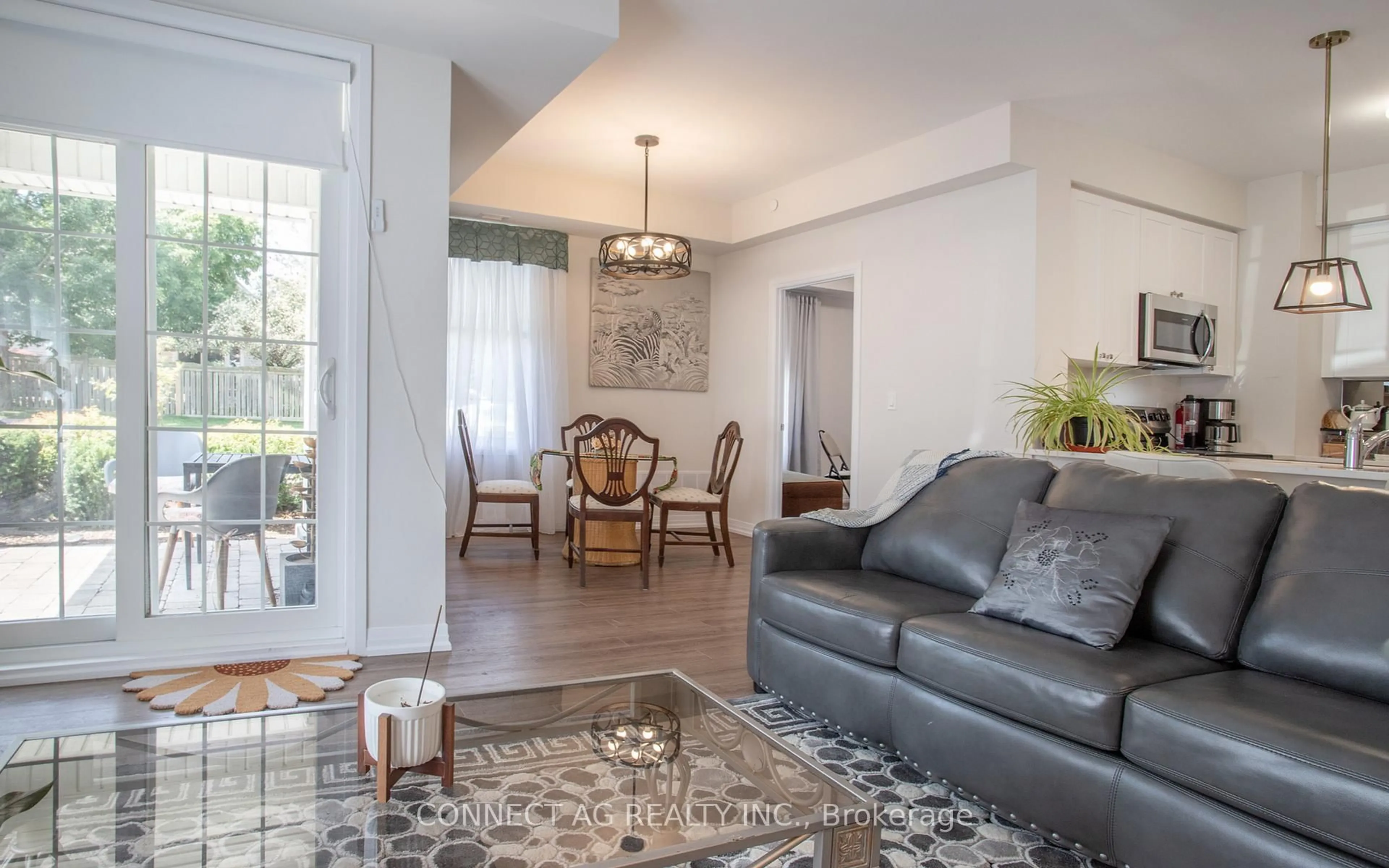 Living room with furniture, wood/laminate floor for 65 Shipway Ave #111, Clarington Ontario L1B 0W2