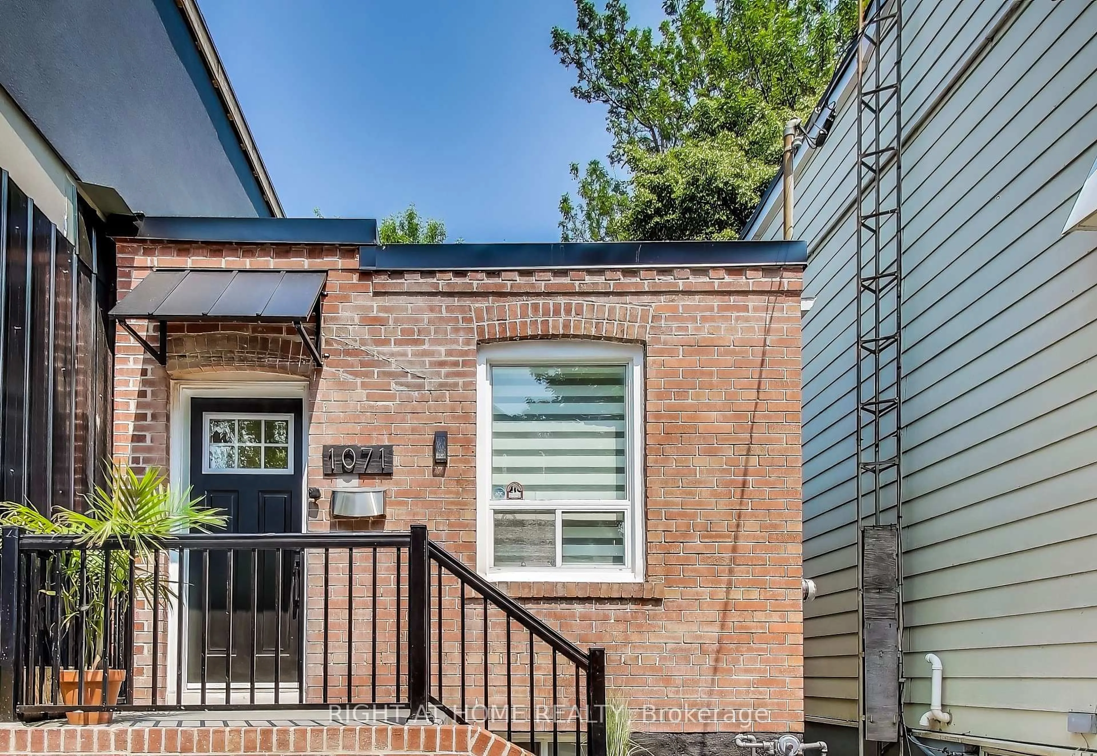 Home with brick exterior material, street for 1071 Craven Rd, Toronto Ontario M4J 4V7