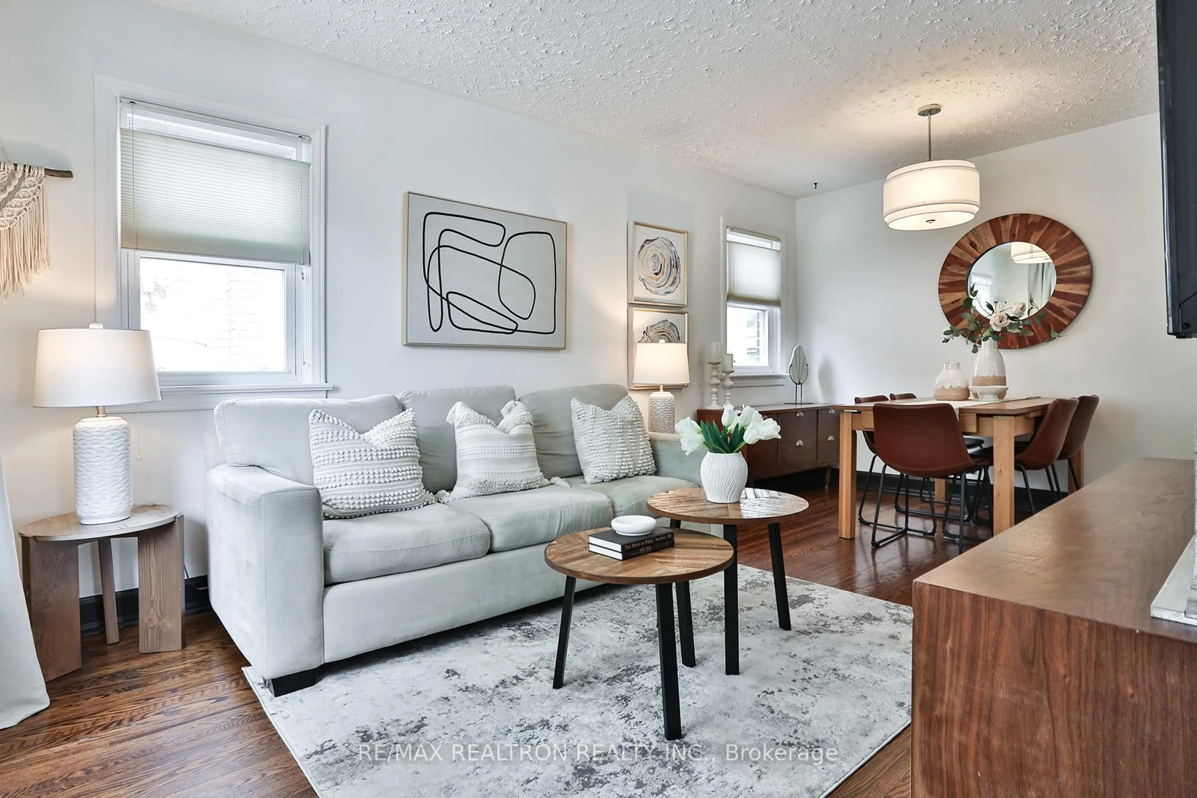 Living room with furniture, wood/laminate floor for 135 Phillip Ave, Toronto Ontario M1N 3R6