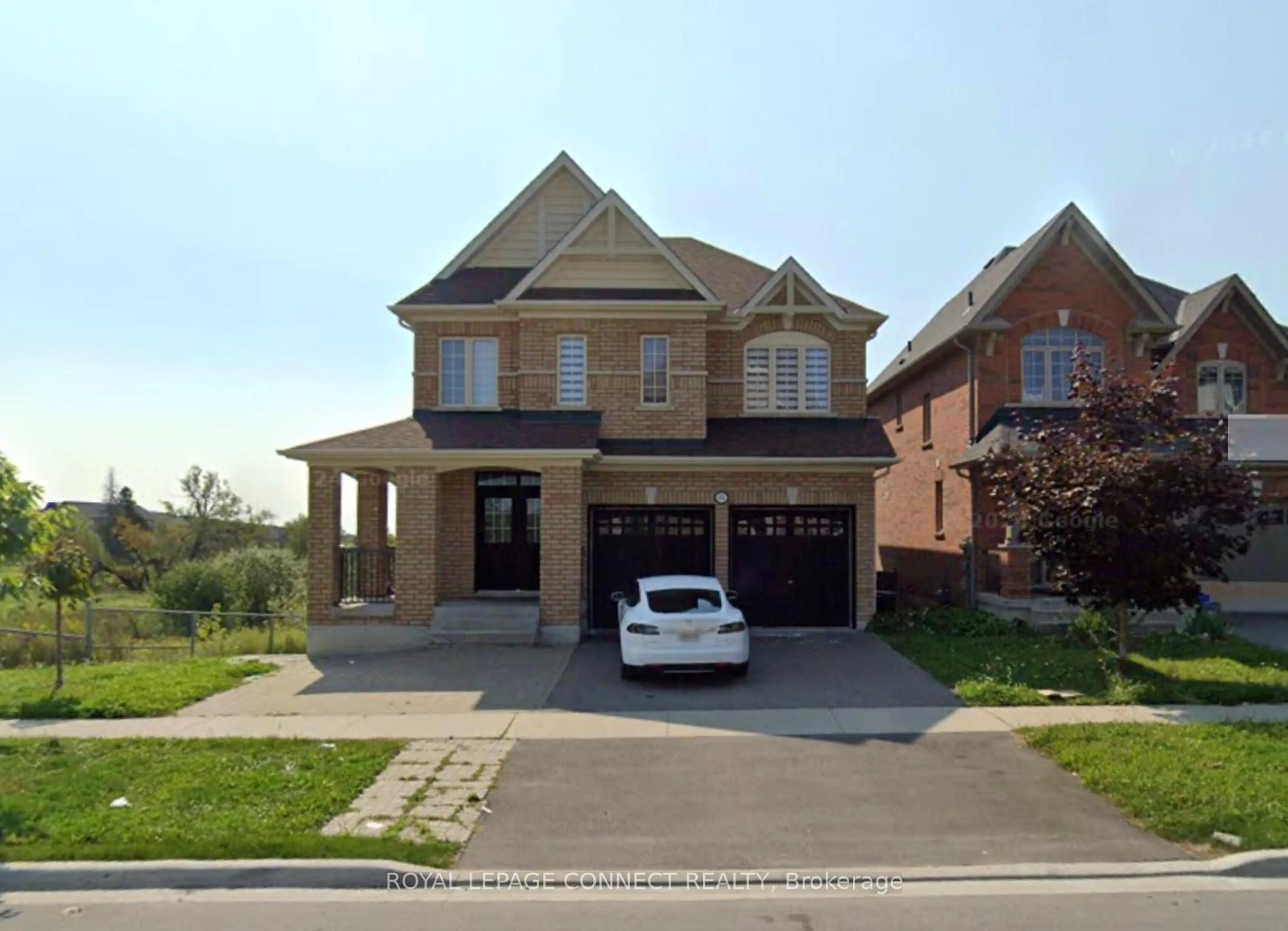 Home with brick exterior material, street for 153 Windfields Farm Dr, Oshawa Ontario L1L 0K2
