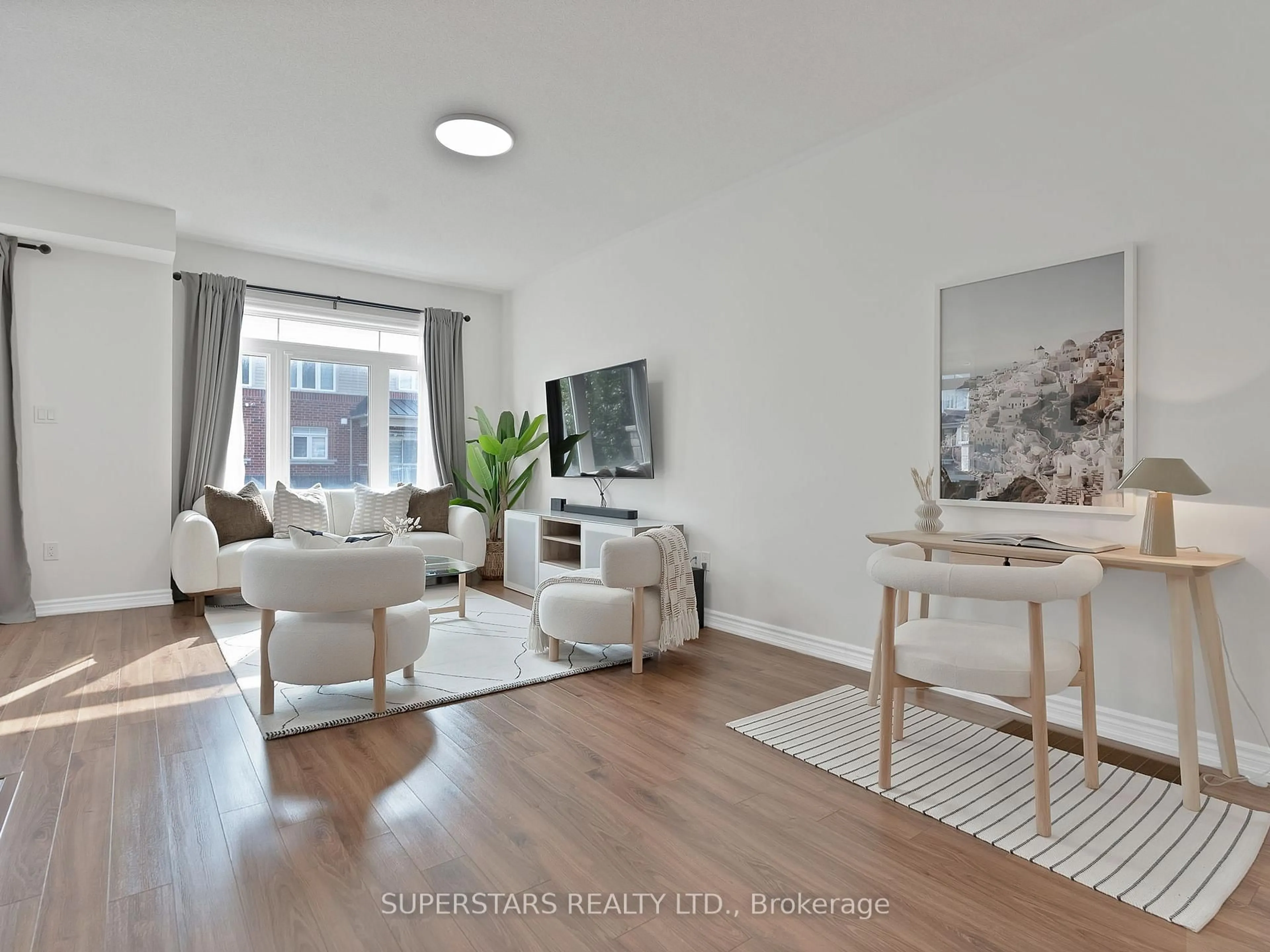 Living room with furniture, wood/laminate floor for 2410 Nantucket Chse, Pickering Ontario L1X 0E5