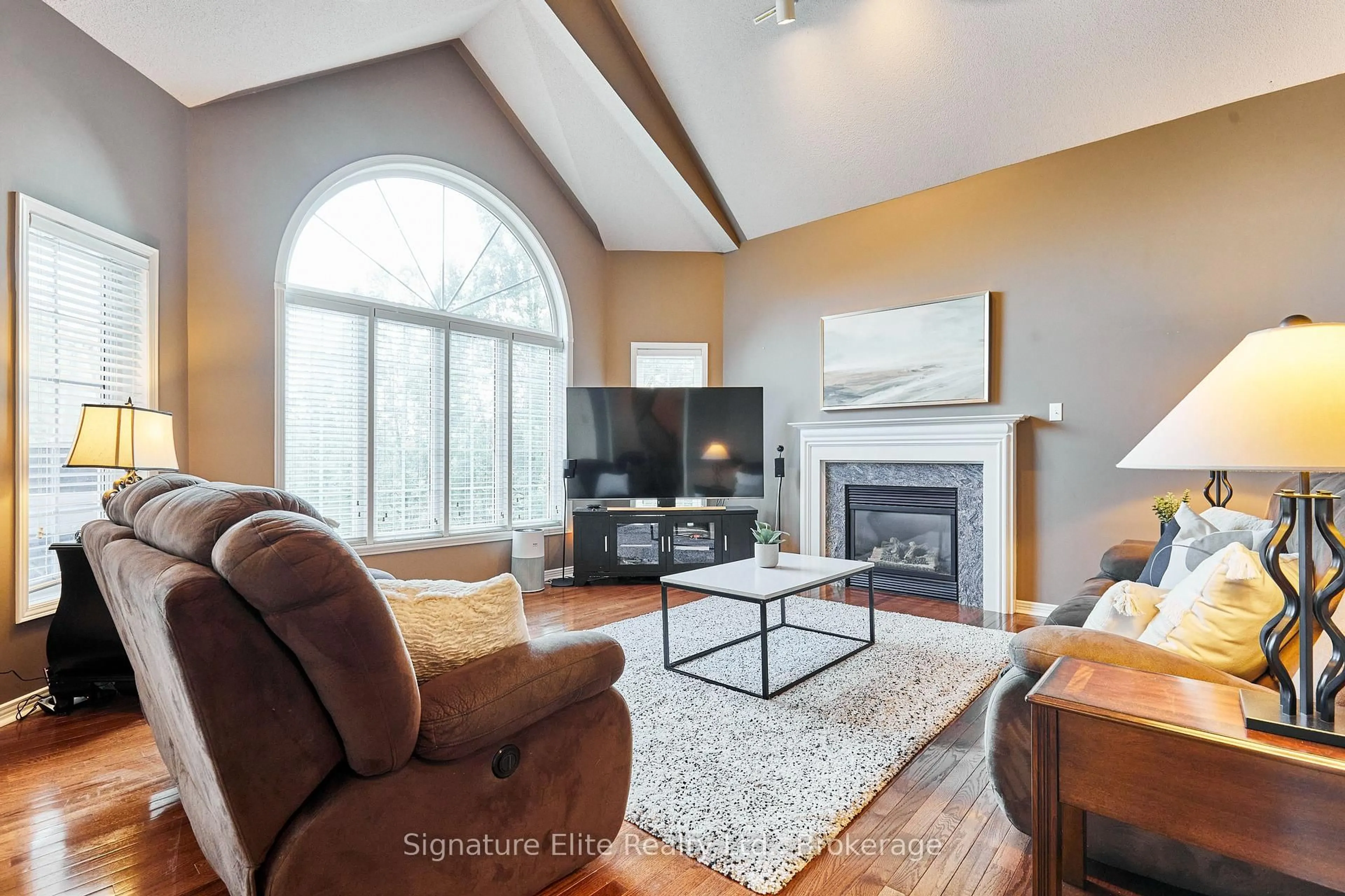 Living room with furniture, wood/laminate floor for 51 Roan Dr, Whitby Ontario L1P 1P3