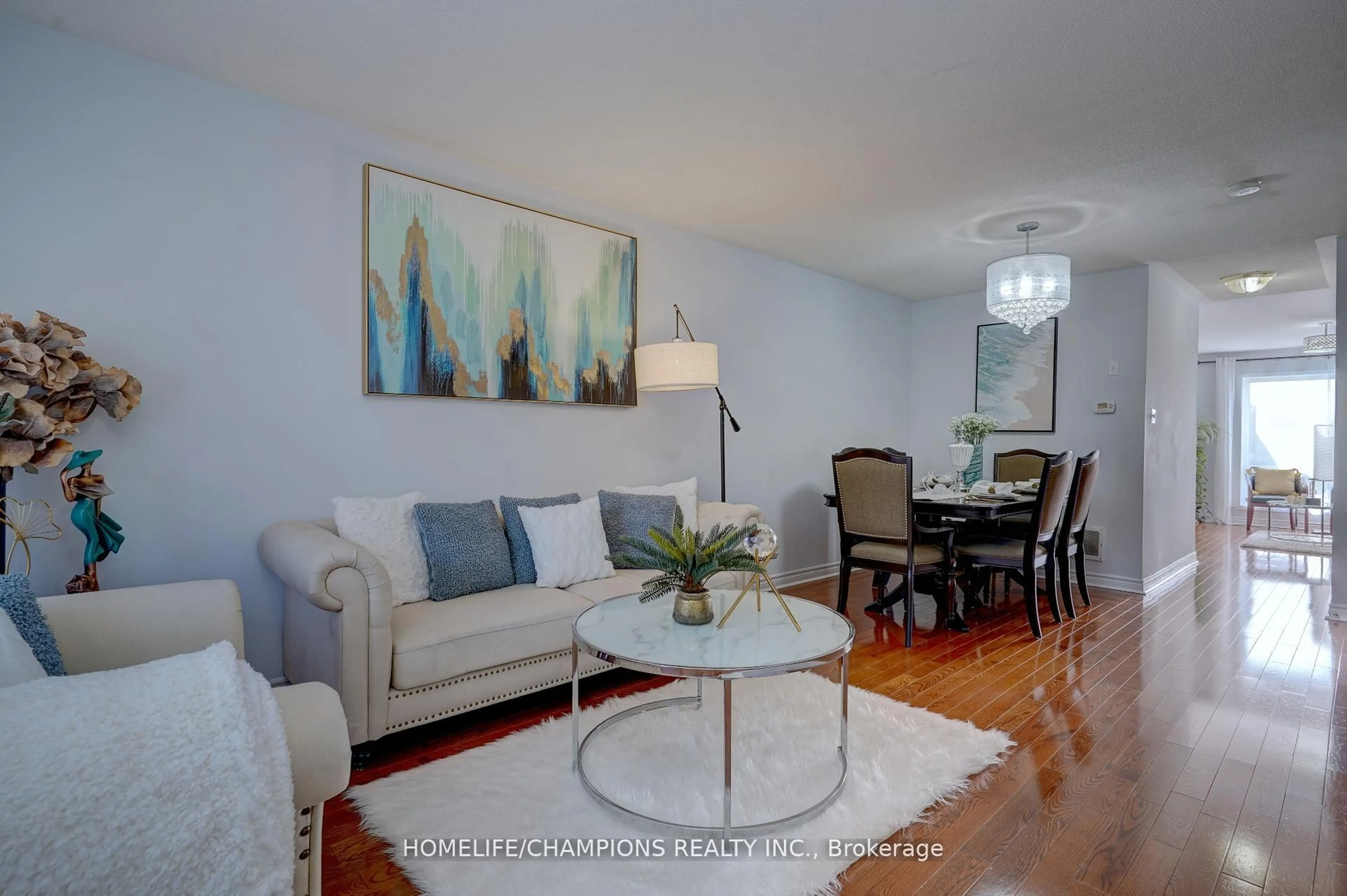 Living room with furniture, wood/laminate floor for 145 Raponi Circ, Toronto Ontario M1X 2C6