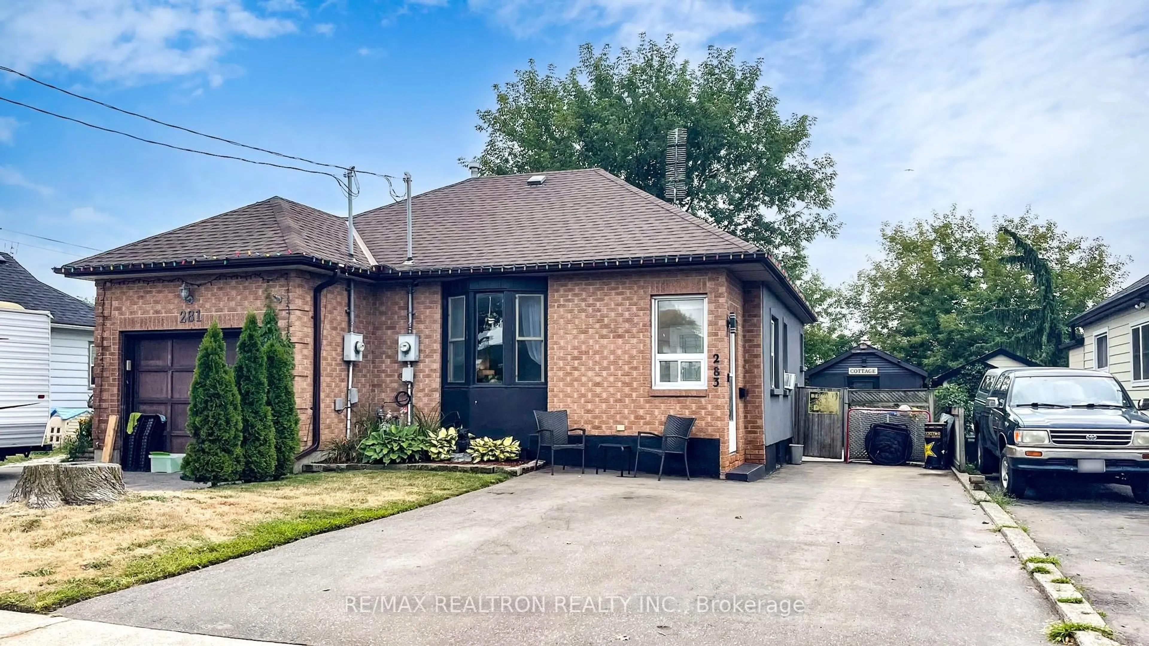 Home with brick exterior material, street for 283 College Ave, Oshawa Ontario L1J 1R9