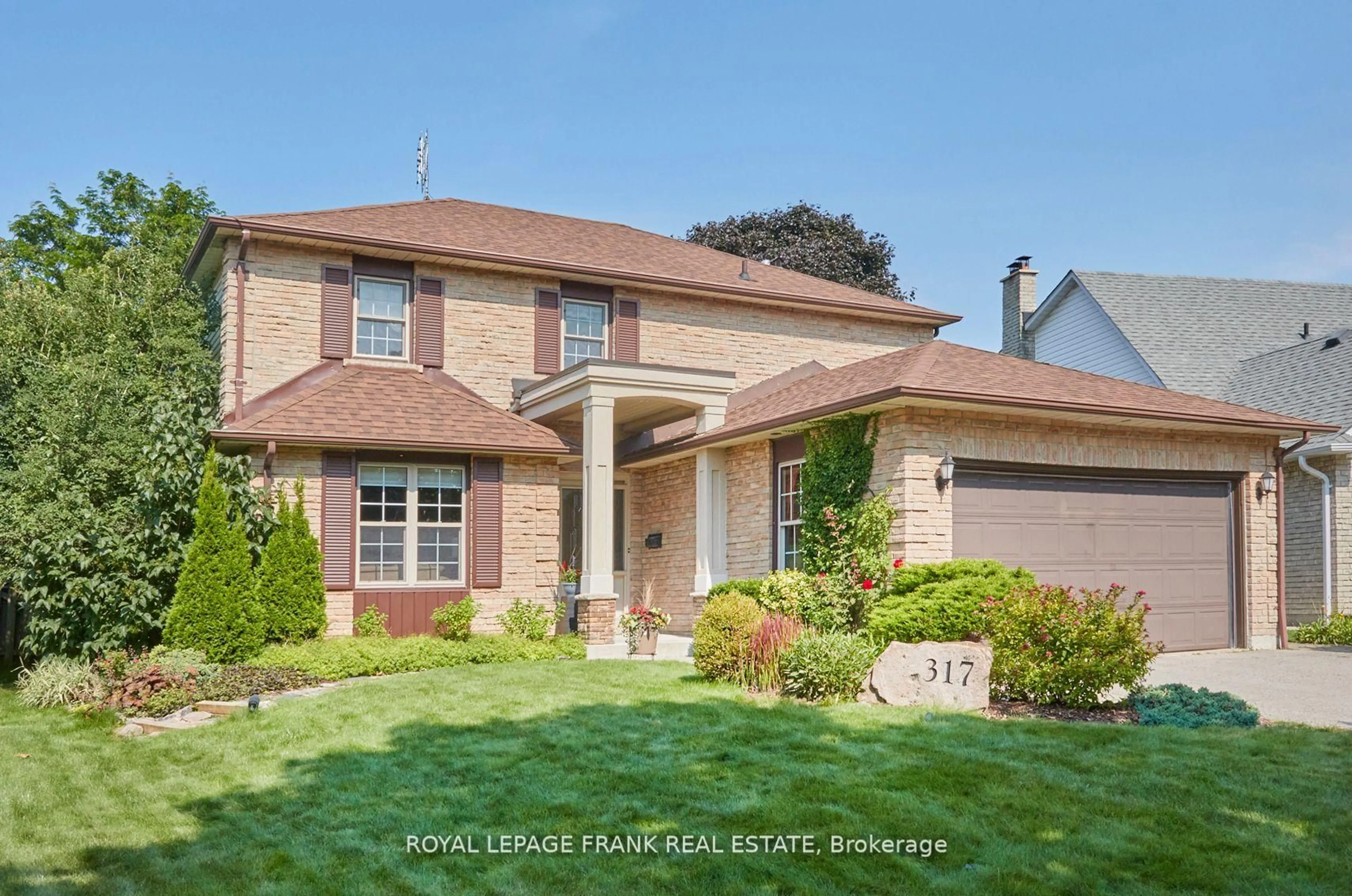 Home with brick exterior material, street for 317 Prince Of Wales Dr, Whitby Ontario L1N 6P2