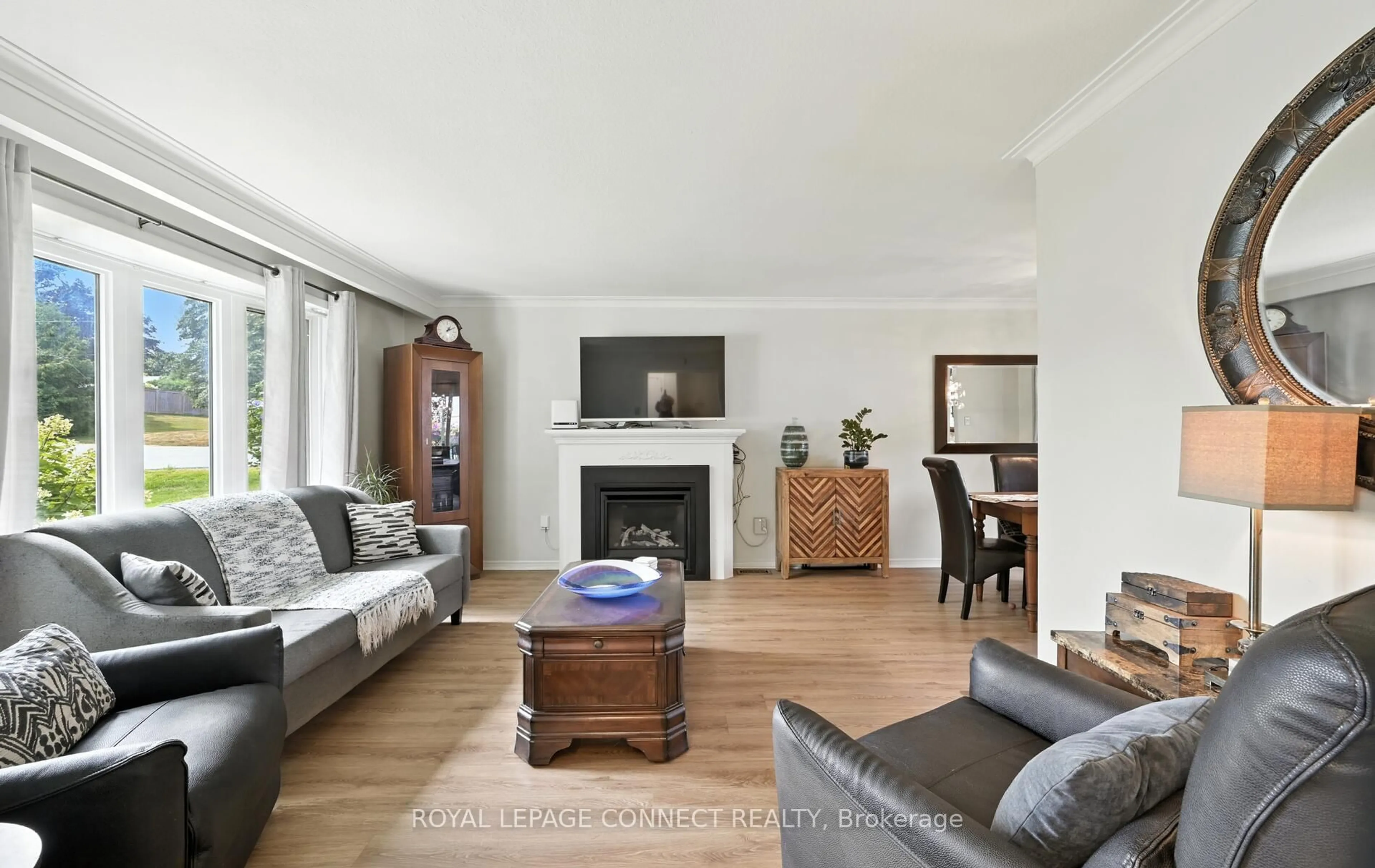 Living room with furniture, wood/laminate floor for 612 Maple St, Whitby Ontario L1N 3A2