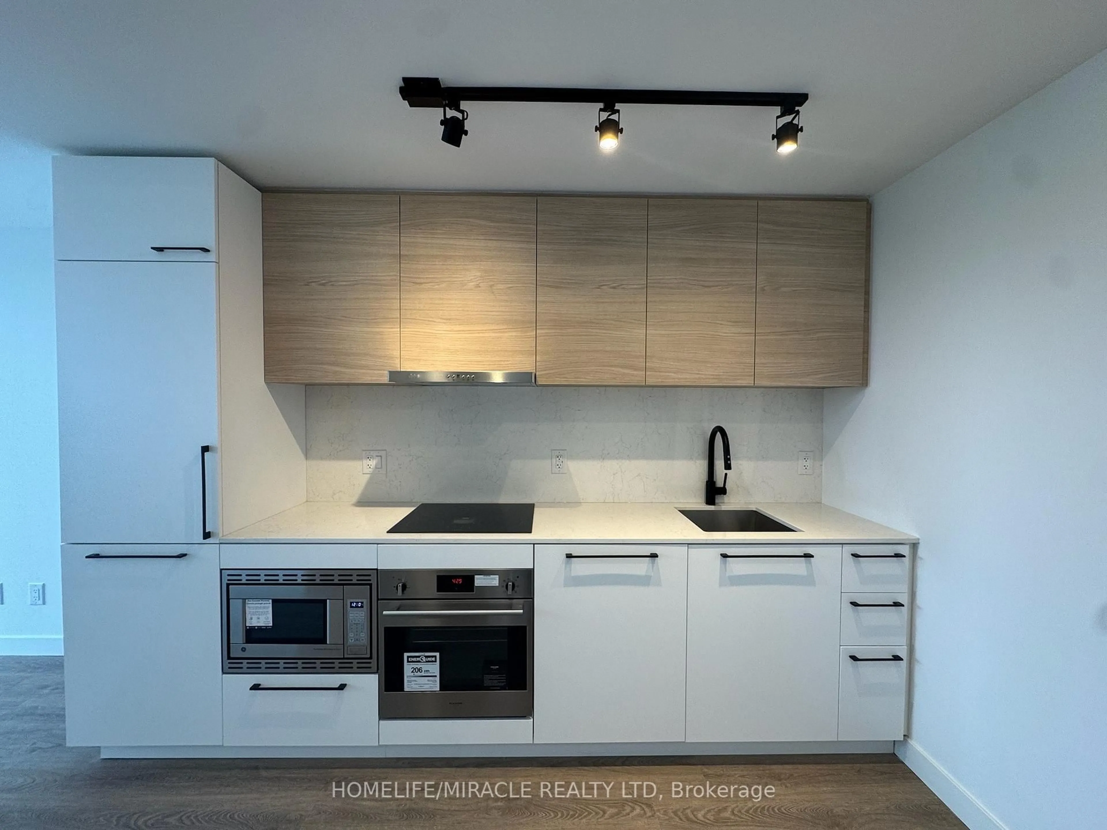 Standard kitchen, wood/laminate floor for 1050 Eastern Ave #1012, Toronto Ontario M4L 0B7